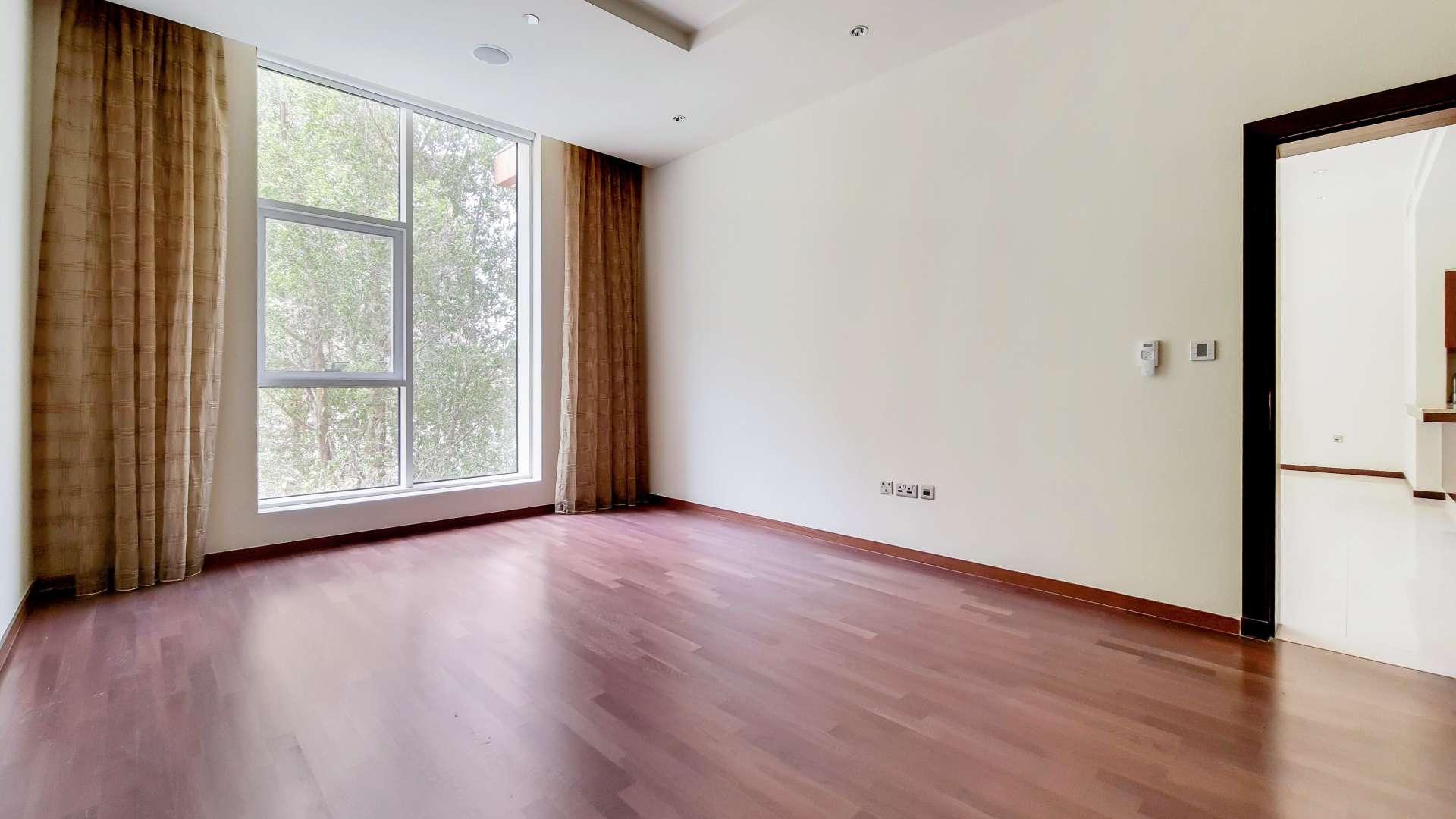 Balcony view from Tiara Residence apartment, lush greenery and modern architecture, Palm Jumeirah