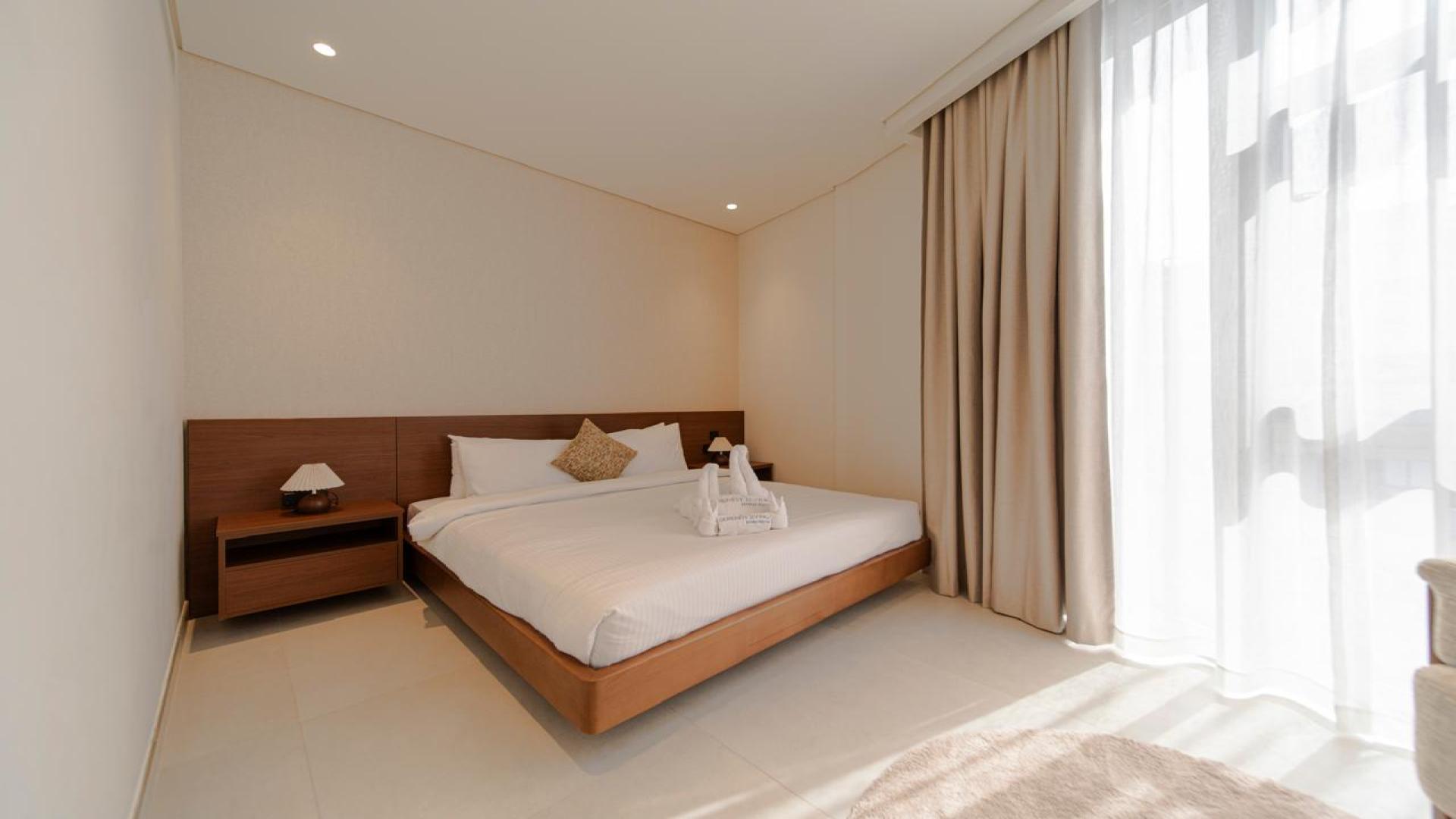 Modern living room in Jumeirah Village Triangle apartment, Milestone Residences. Cozy seating arrangement