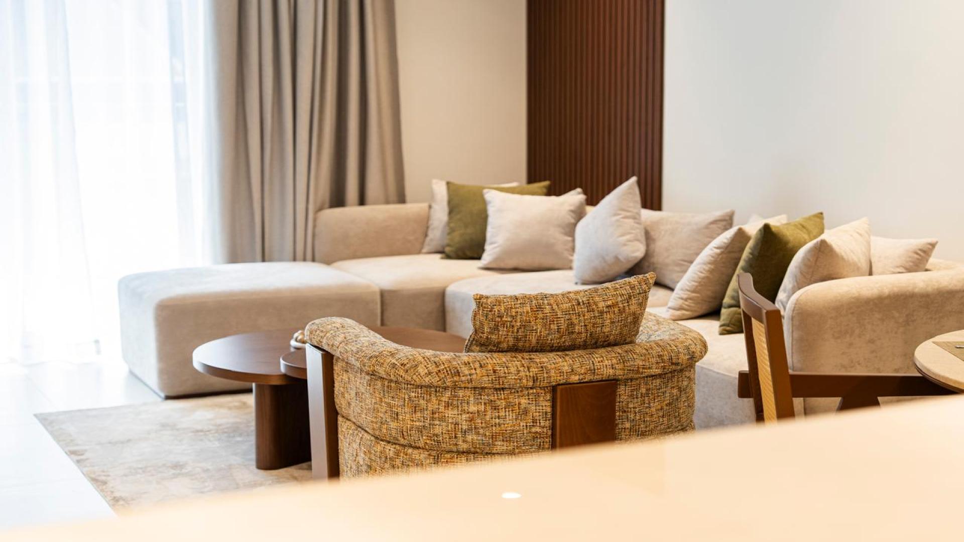Modern kitchen and dining area in Jumeirah Village Triangle apartment for rent, Milestone Residences
