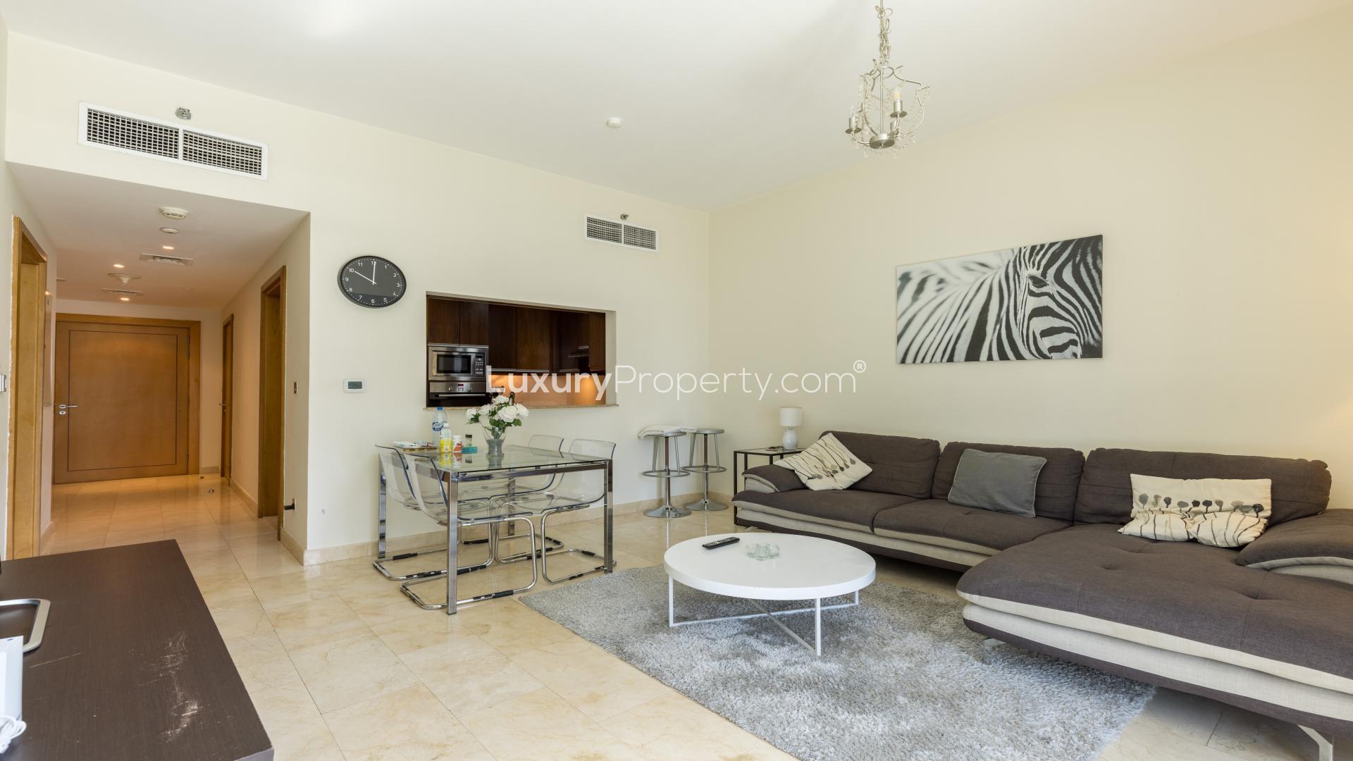 Modern living room in Trident Bayside apartment, featuring cozy sofa and stylish decor