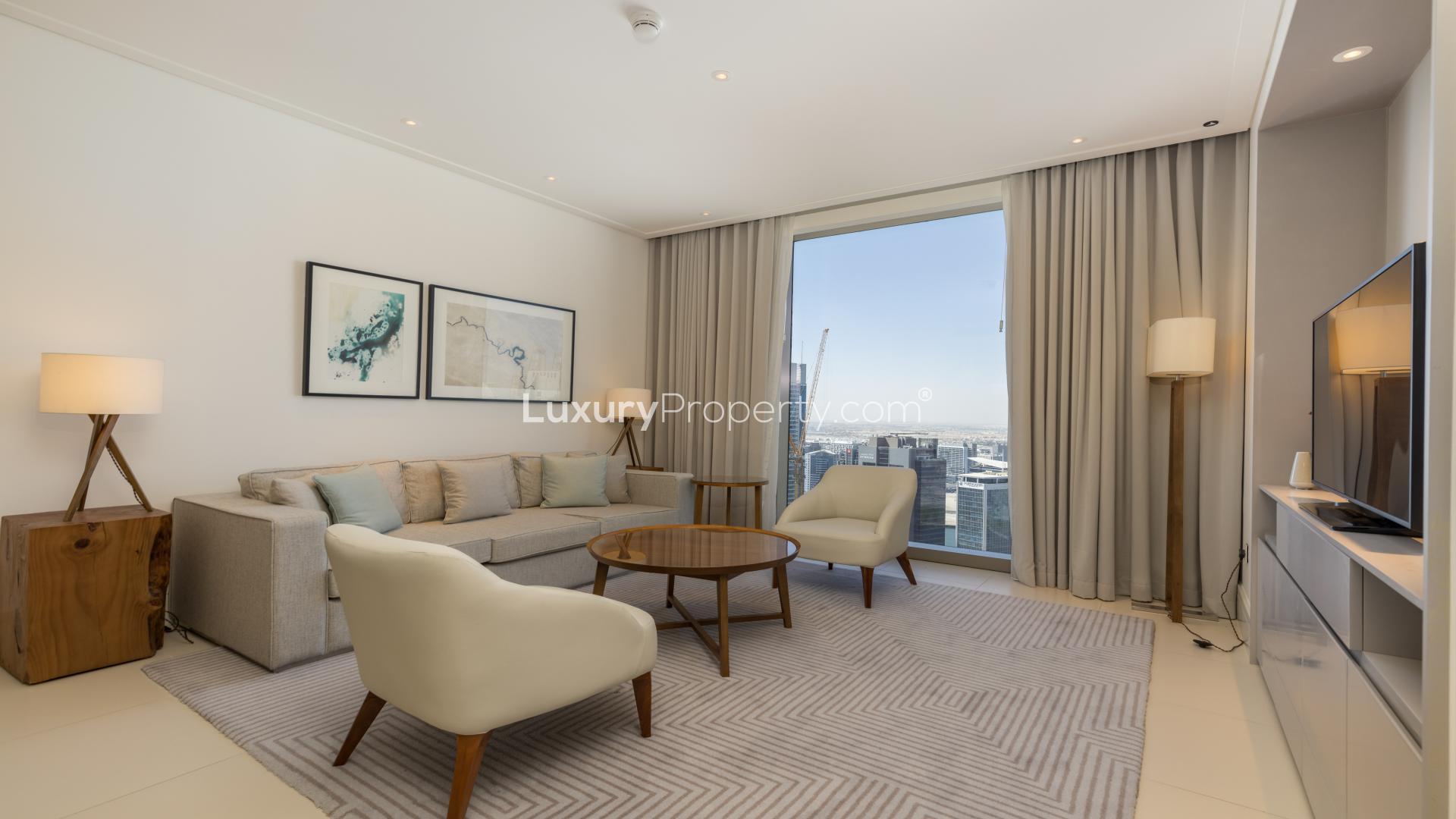 Modern living room in 1-bed apartment, Vida Residences Downtown Dubai, open kitchen view