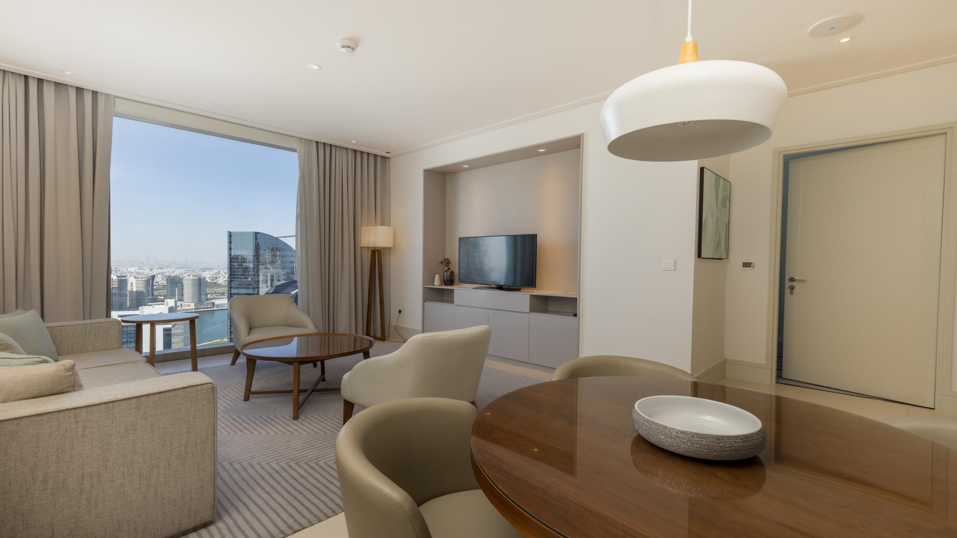 Luxurious furnished apartment living room with modern decor in Vida Residence Downtown Dubai