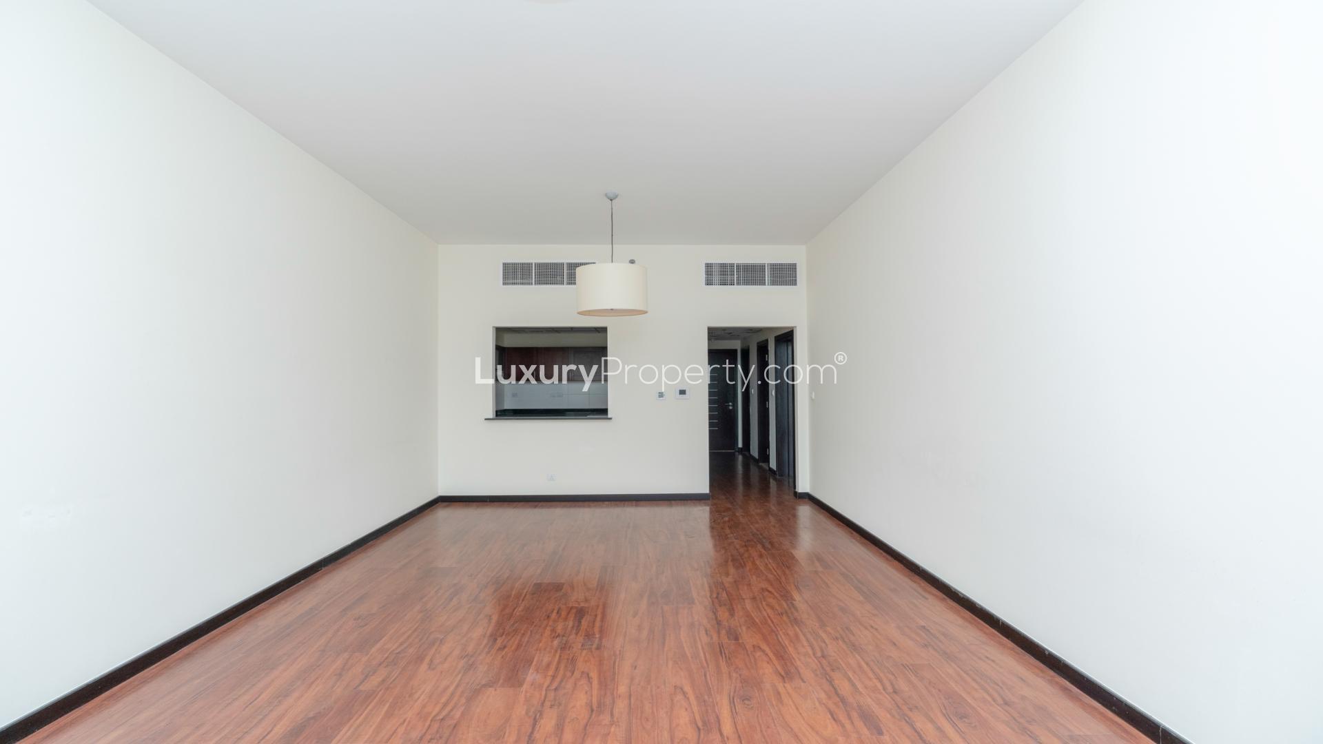 Modern living room with wooden flooring in Green Lake Tower 2 apartment, Jumeirah Lake Towers