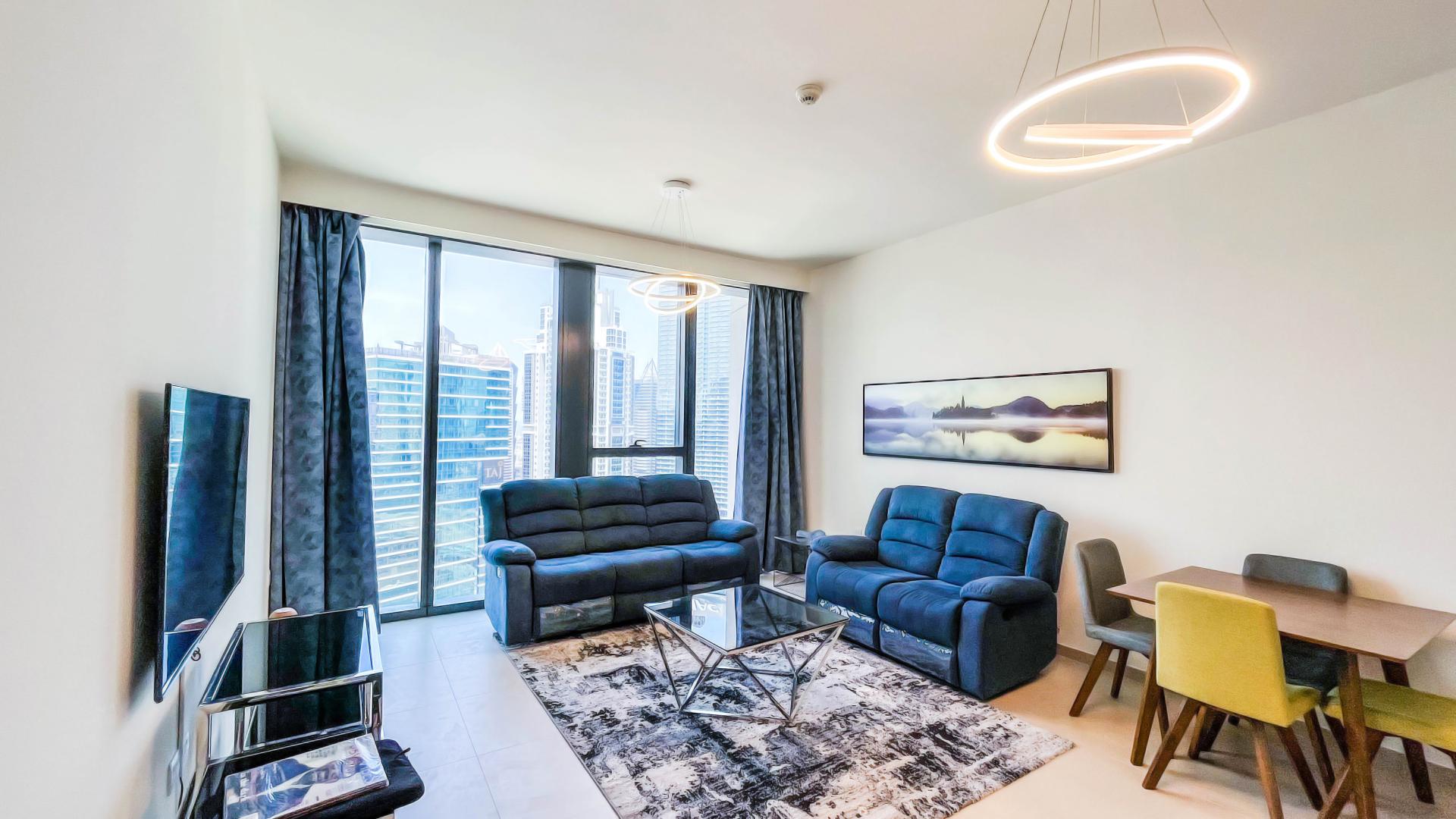 Modern living room in luxury 1-bedroom apartment, BLVD Heights, Downtown Dubai, skyline view