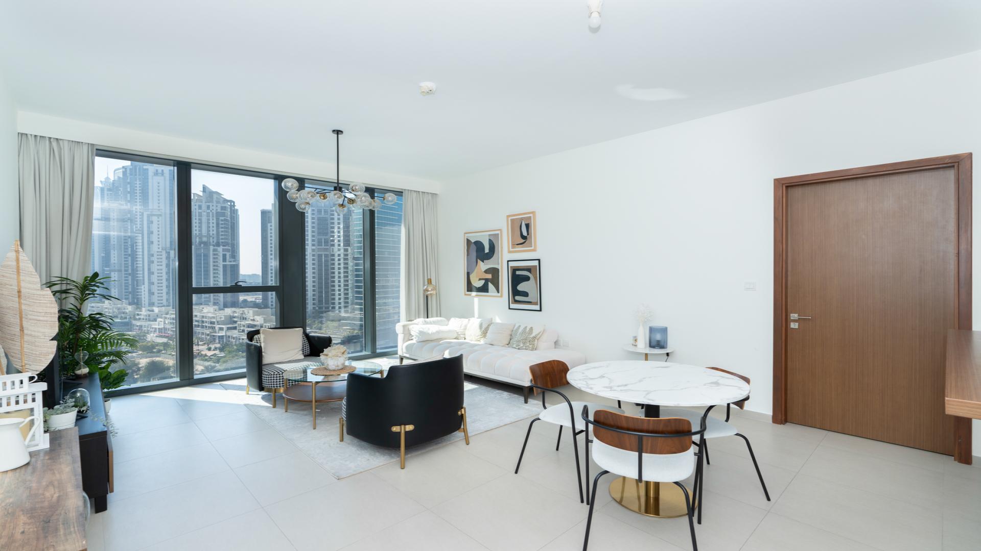 Modern living room in 1-bedroom apartment, Downtown Dubai, with stylish decor and natural light