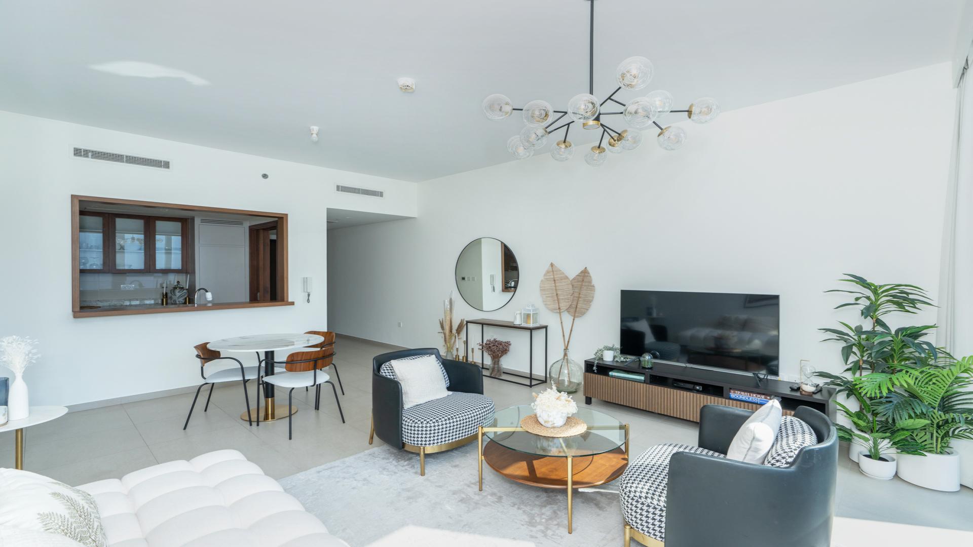 Stylish living room in 1-bedroom Downtown Dubai apartment with city views, modern decor