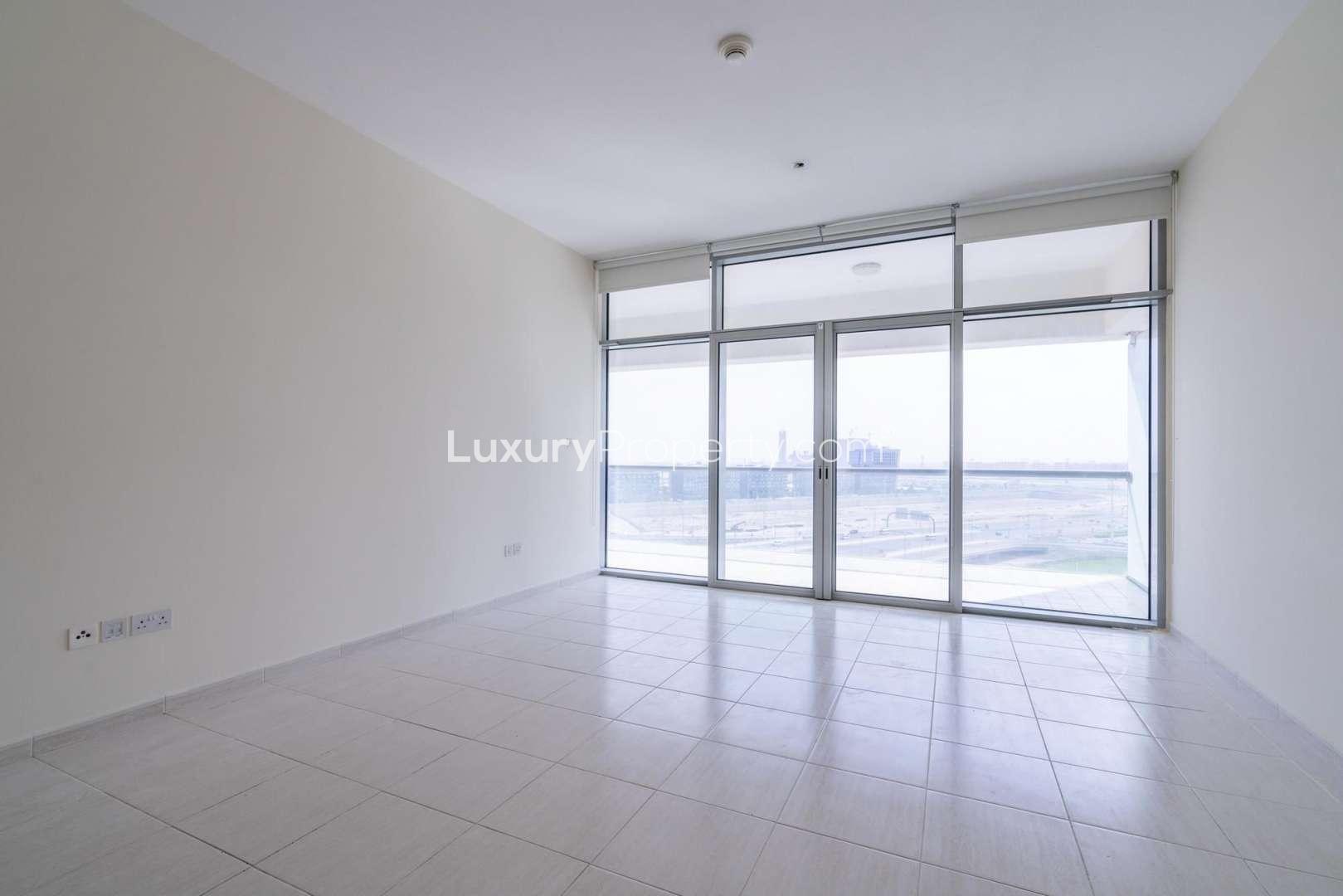 Exterior view of Windsor Manor apartment building with canal in Business Bay