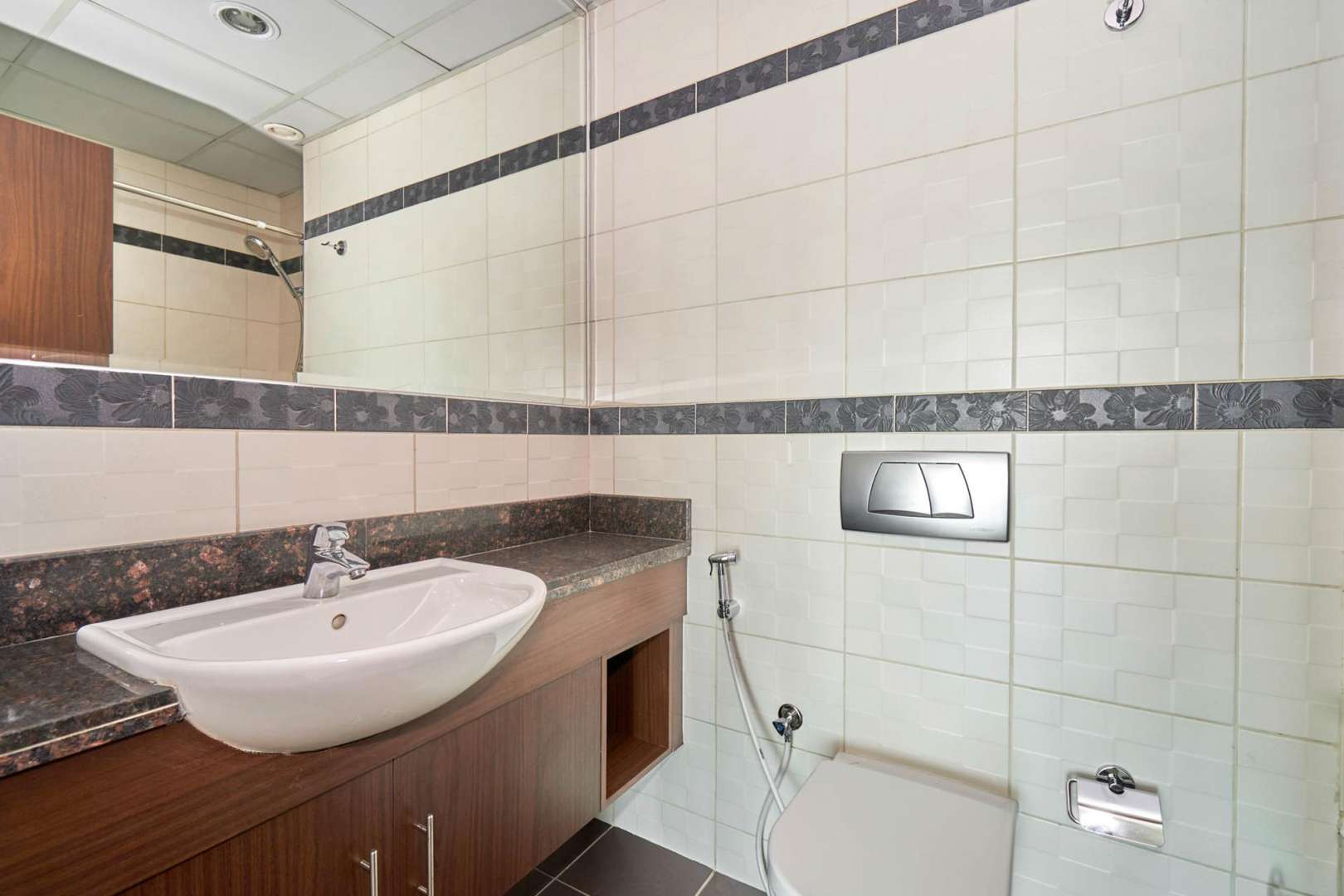 Bright living room in 1-bedroom apartment, Windsor Manor, Business Bay, featuring large windows