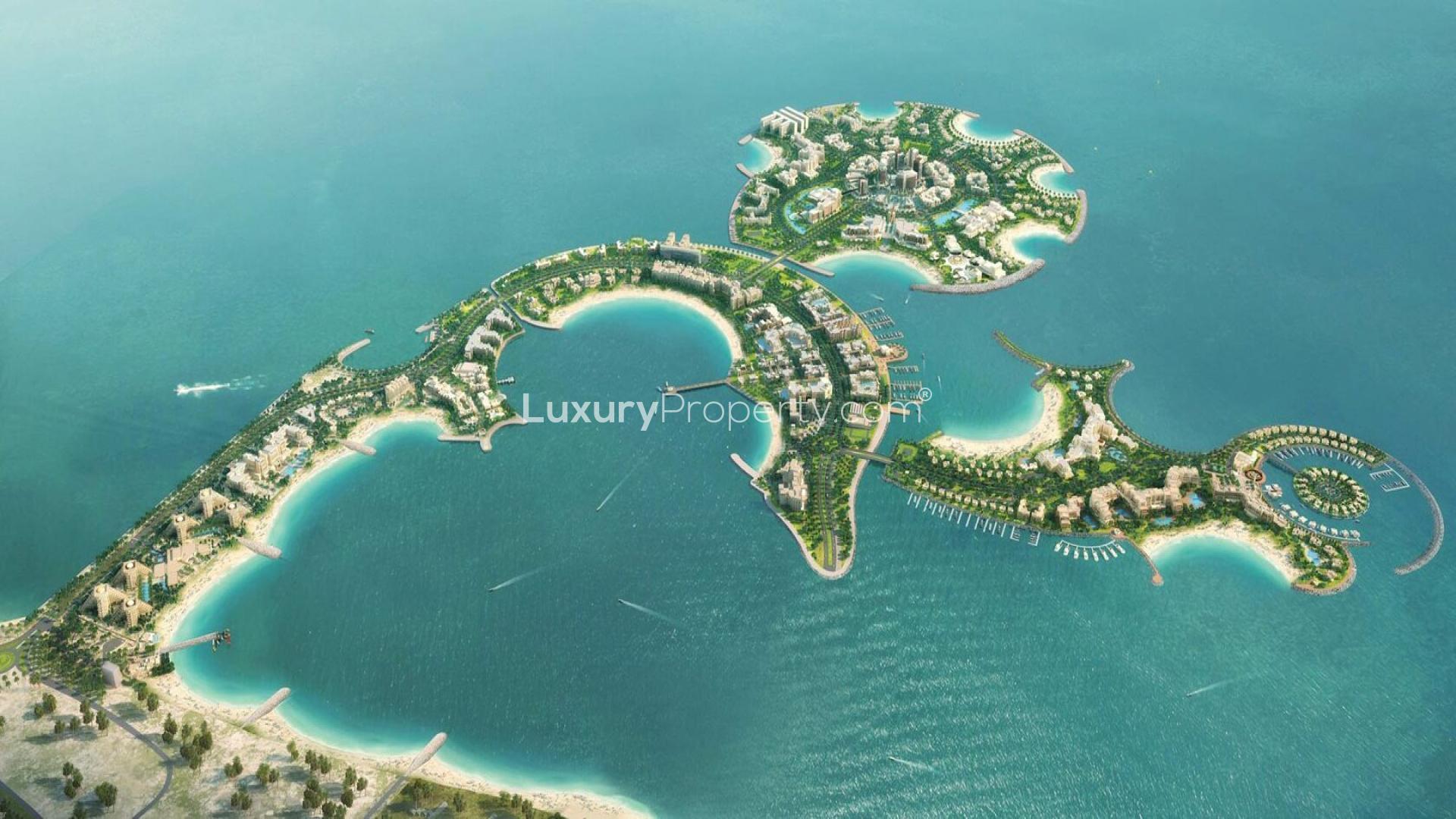 Aerial view of Al Marjan Island, showcasing luxurious waterfront apartments in Moonstone community