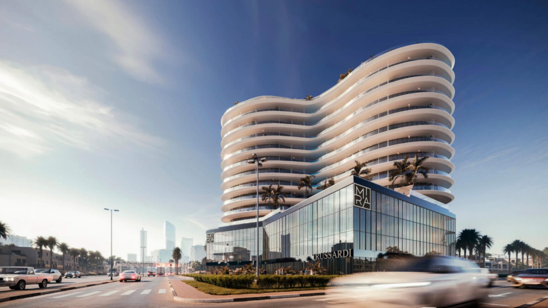 Modern Trussardi Residences apartment building in Al Furjan with palm trees and blue sky