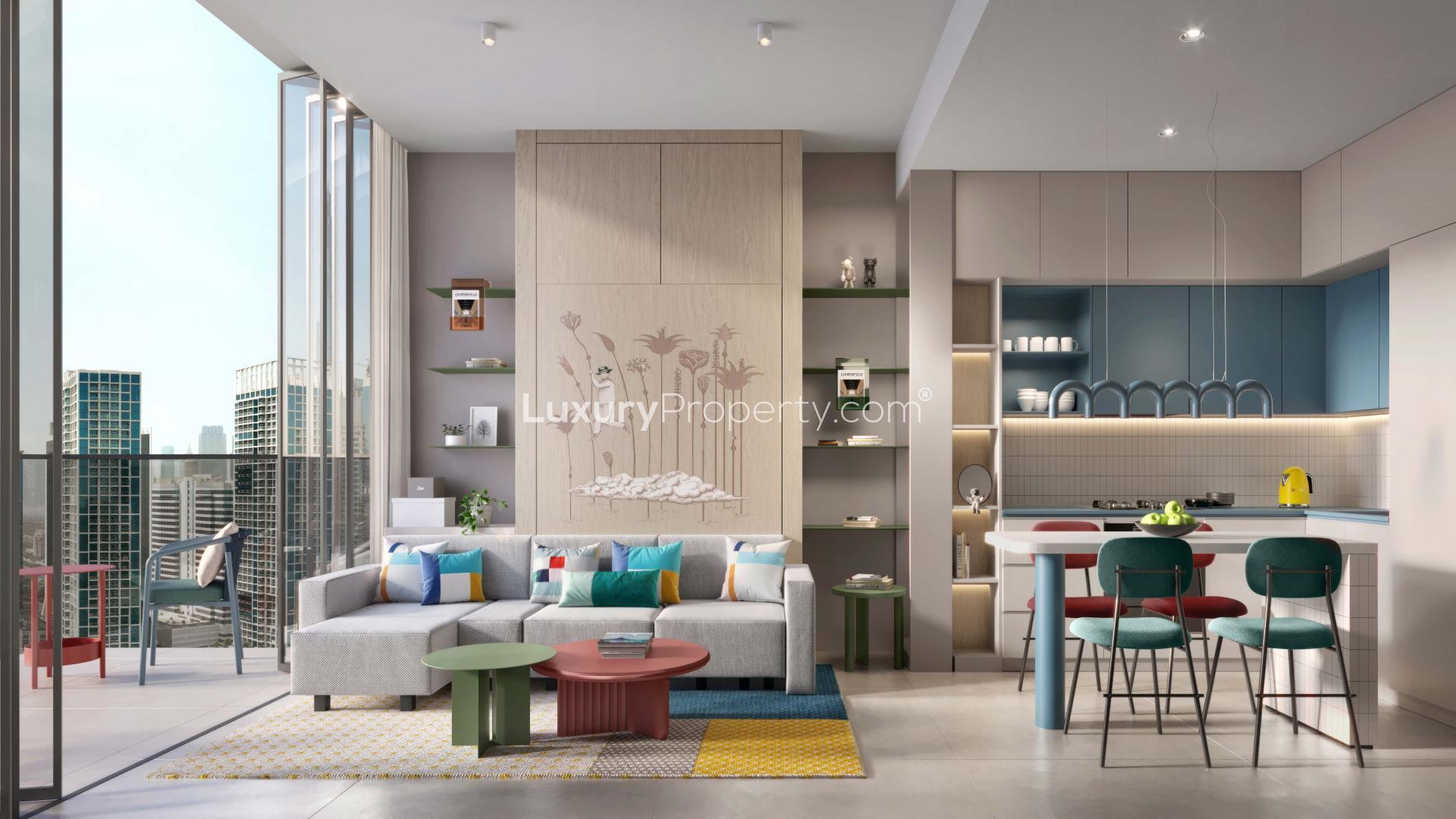 "Modern Rove Home apartment with balcony view of Business Bay skyline, Dubai, for sale.",Modern living room and kitchen in Rove Home apartment, Business Bay, with city views