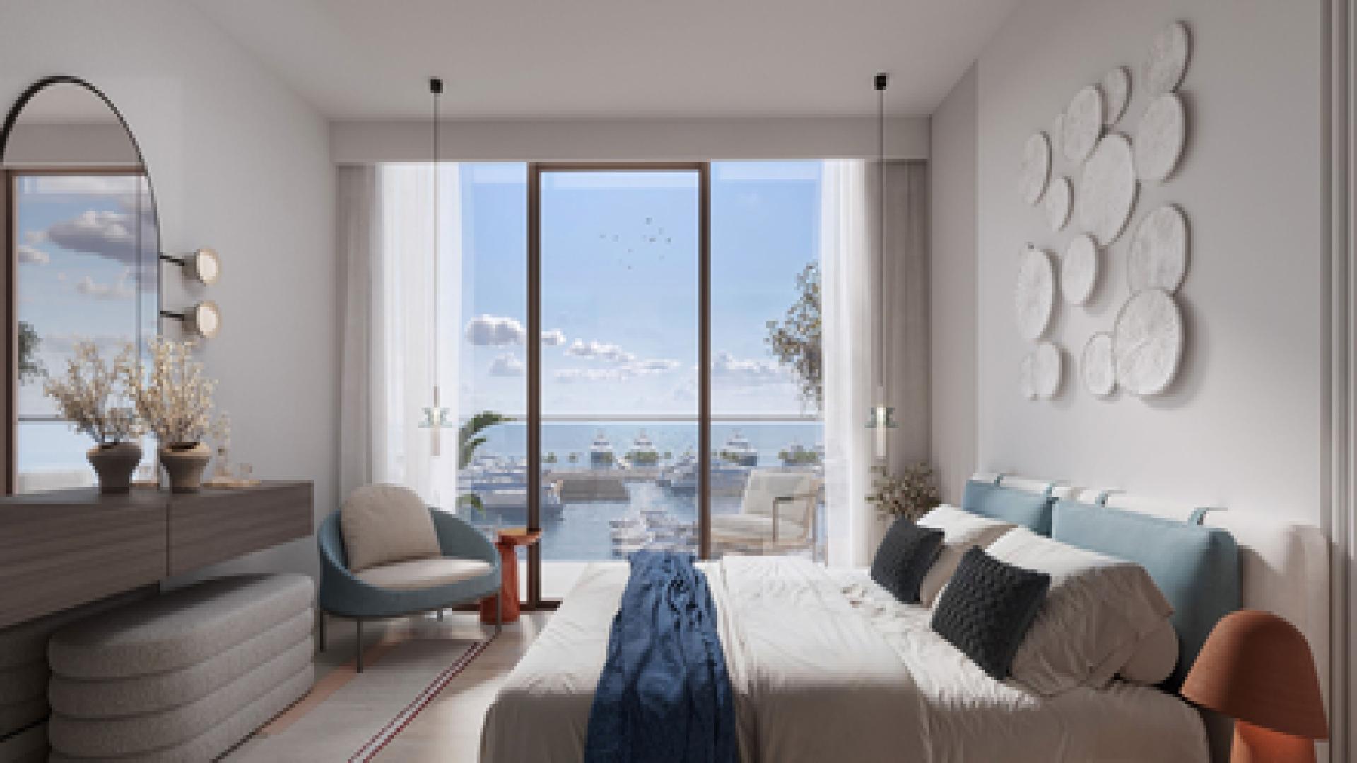 Luxurious waterfront apartment exterior in Rashid Yachts and Marina, with palm-lined promenade