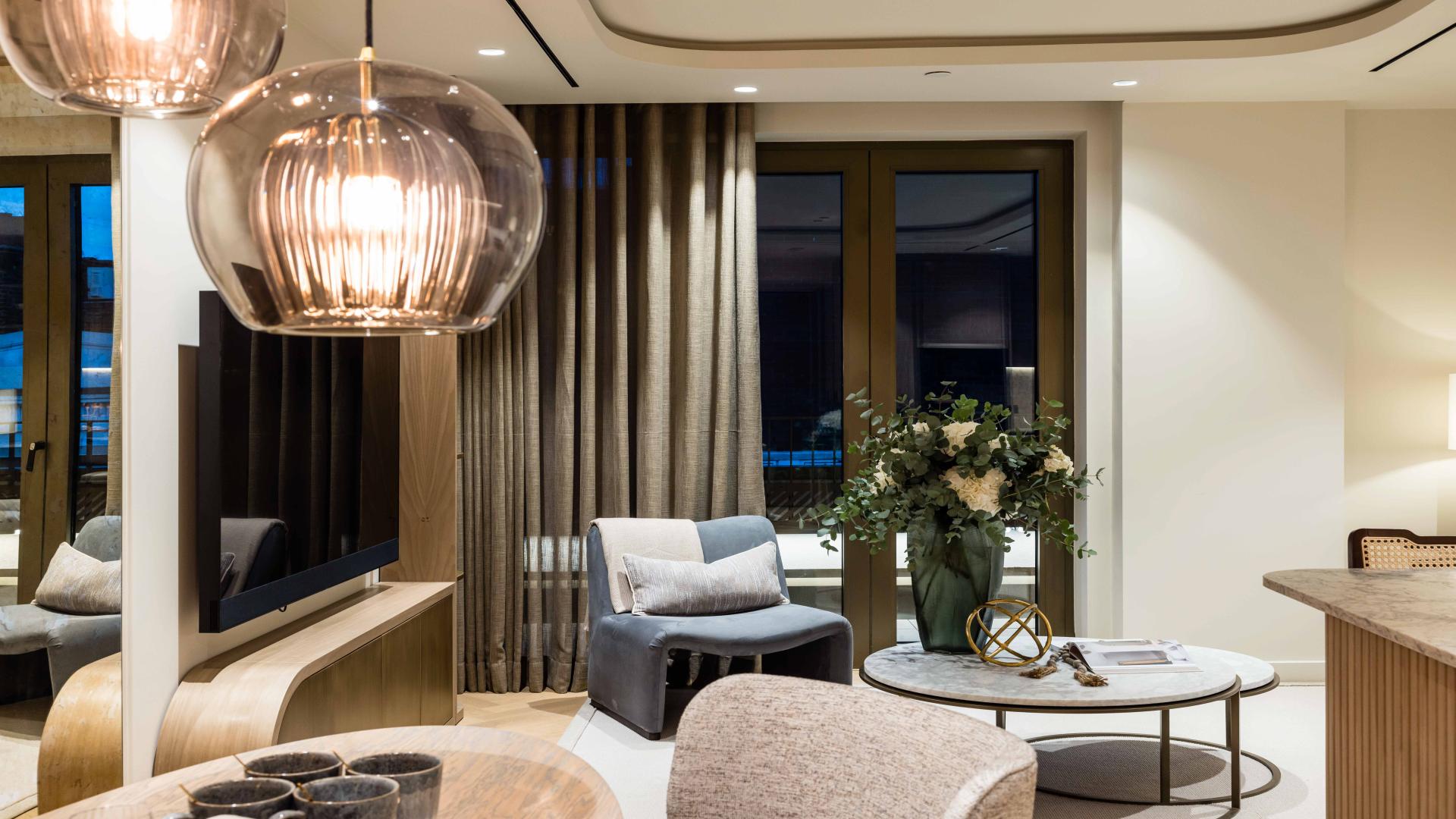 Modern living area in luxury Soho penthouse with elegant decor and open-plan design