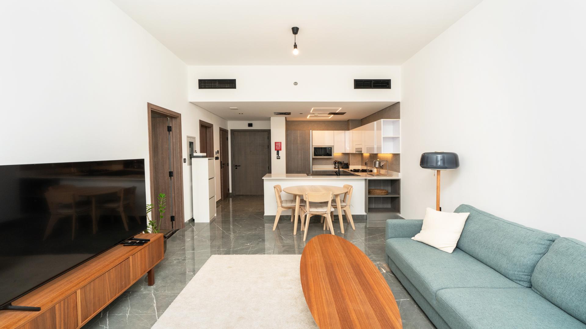 Modern living room in 1-bedroom apartment, Joya Blanca Residences, Arjan, featuring sleek furnishings