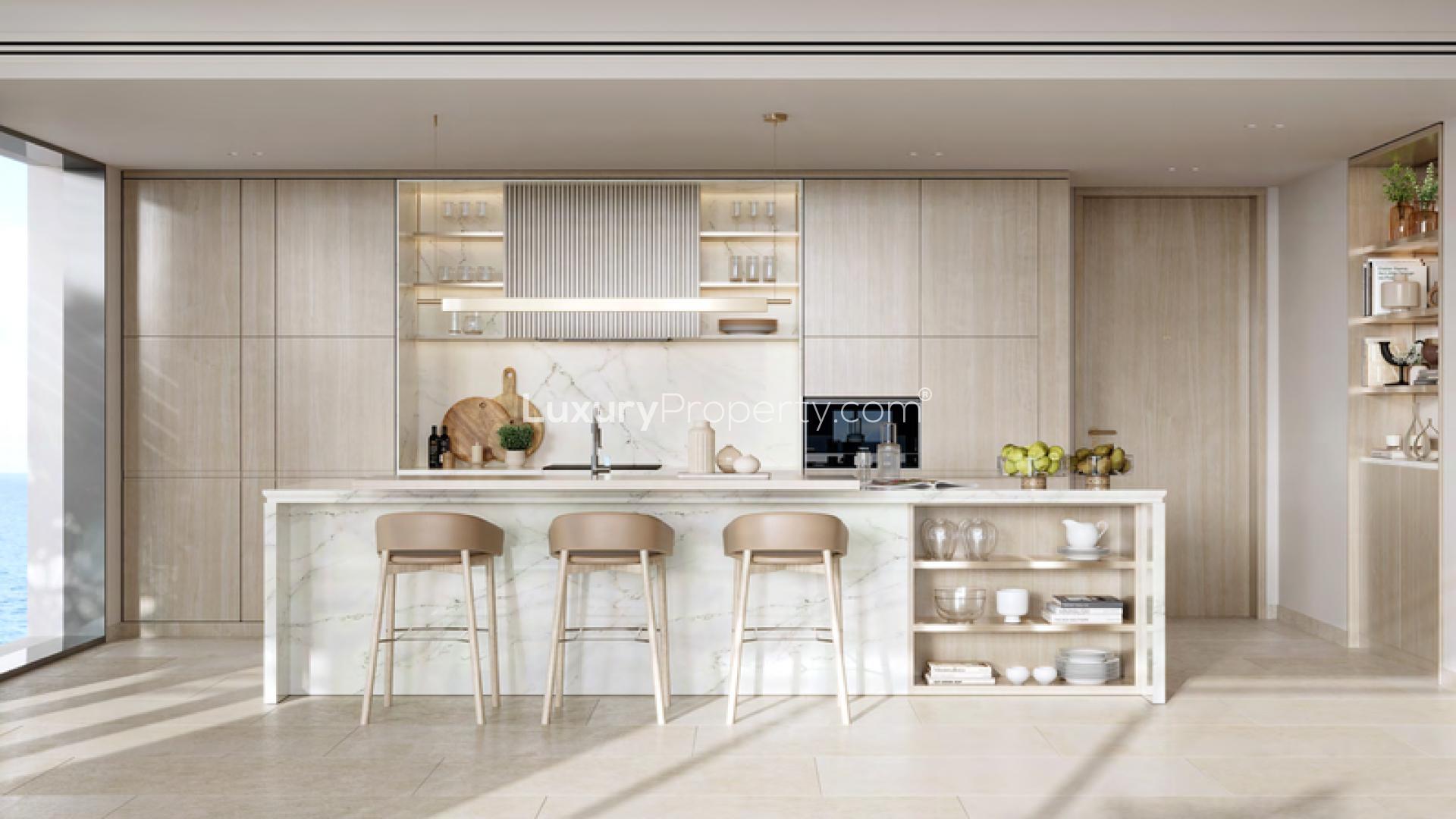 Modern open-plan living room and kitchen in Playa Del Sol apartment, Al Marjan Island