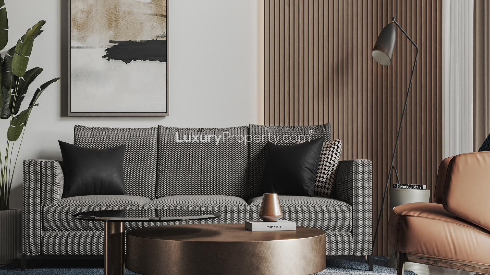 "Modern high-rise apartment building in Franck Muller Vanguard, Dubai Marina, for sale.",Modern living room in Franck Muller Vanguard, Dubai Marina apartment, featuring stylish decor and furniture
