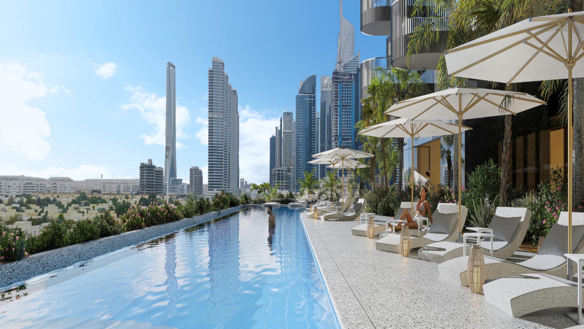 Infinity pool with city skyline view at W Residences, JLT, modern 1-bedroom apartment