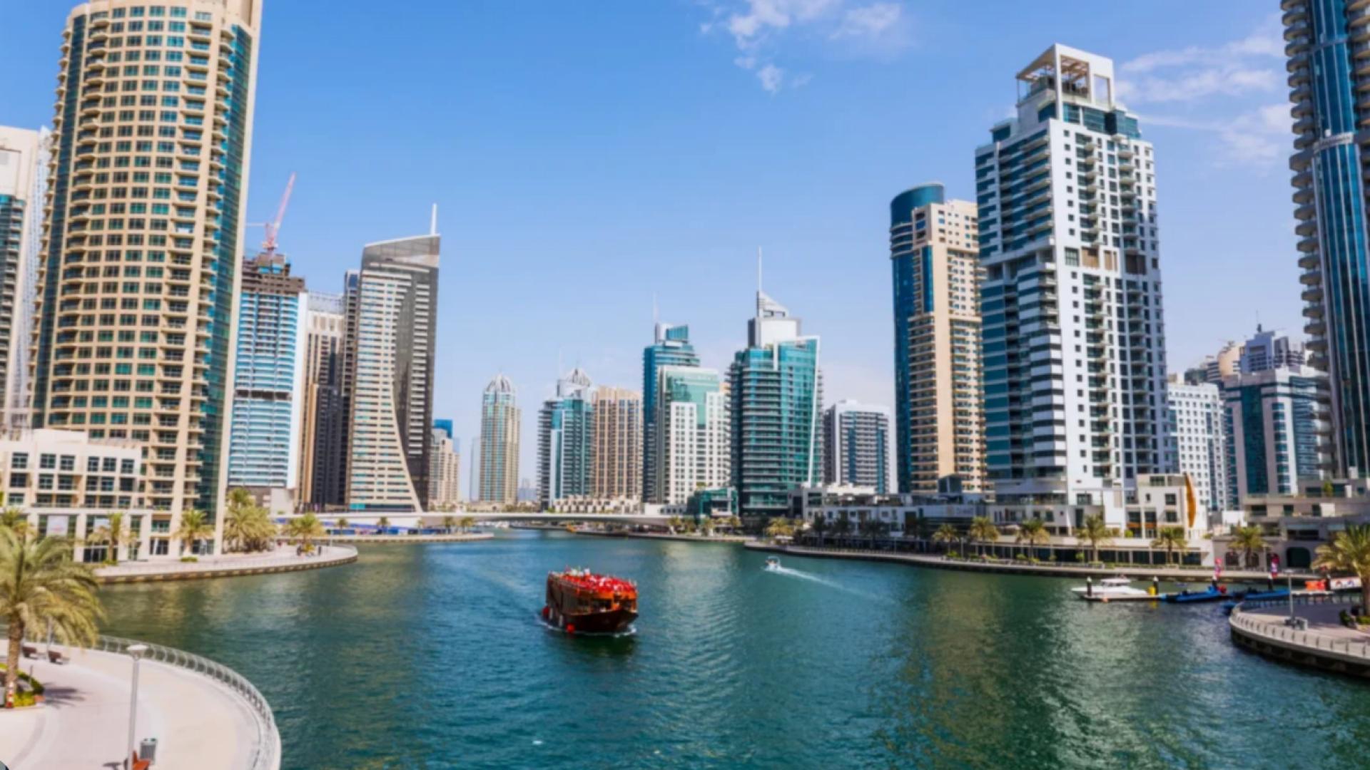 Dubai Marina view with yachts and skyscrapers near Pelagos residential apartments