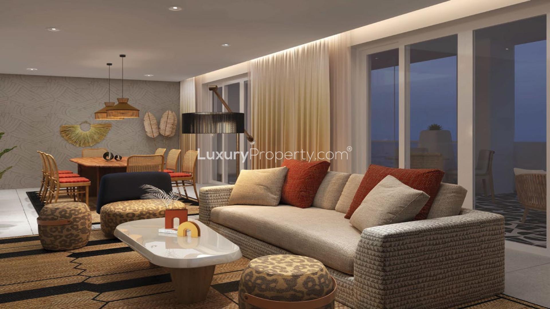 Modern bedroom in Mahe Island apartment, featuring elegant decor and sea view balcony