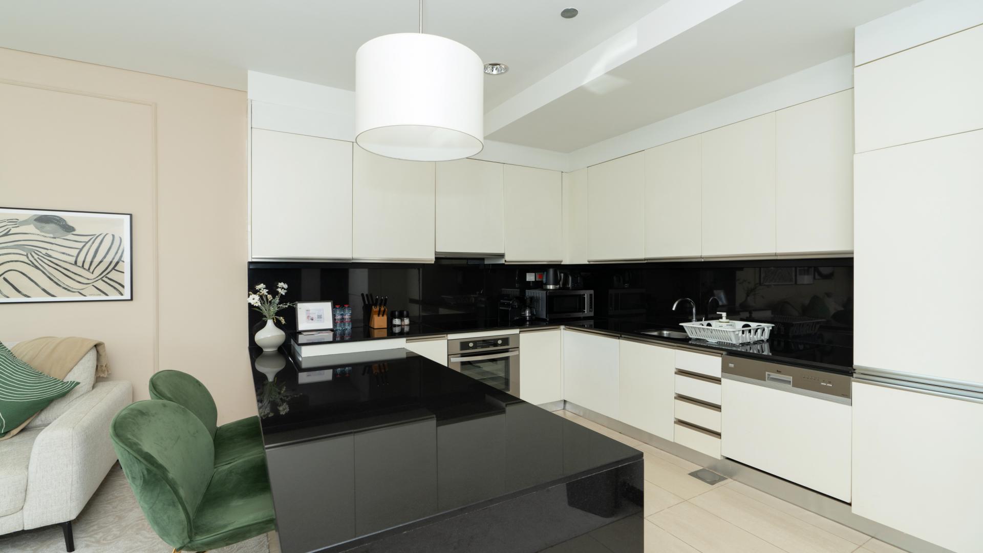 High-floor furnished apartment kitchen with modern design, Dubai Marina, JW Marriott Hotel Marina