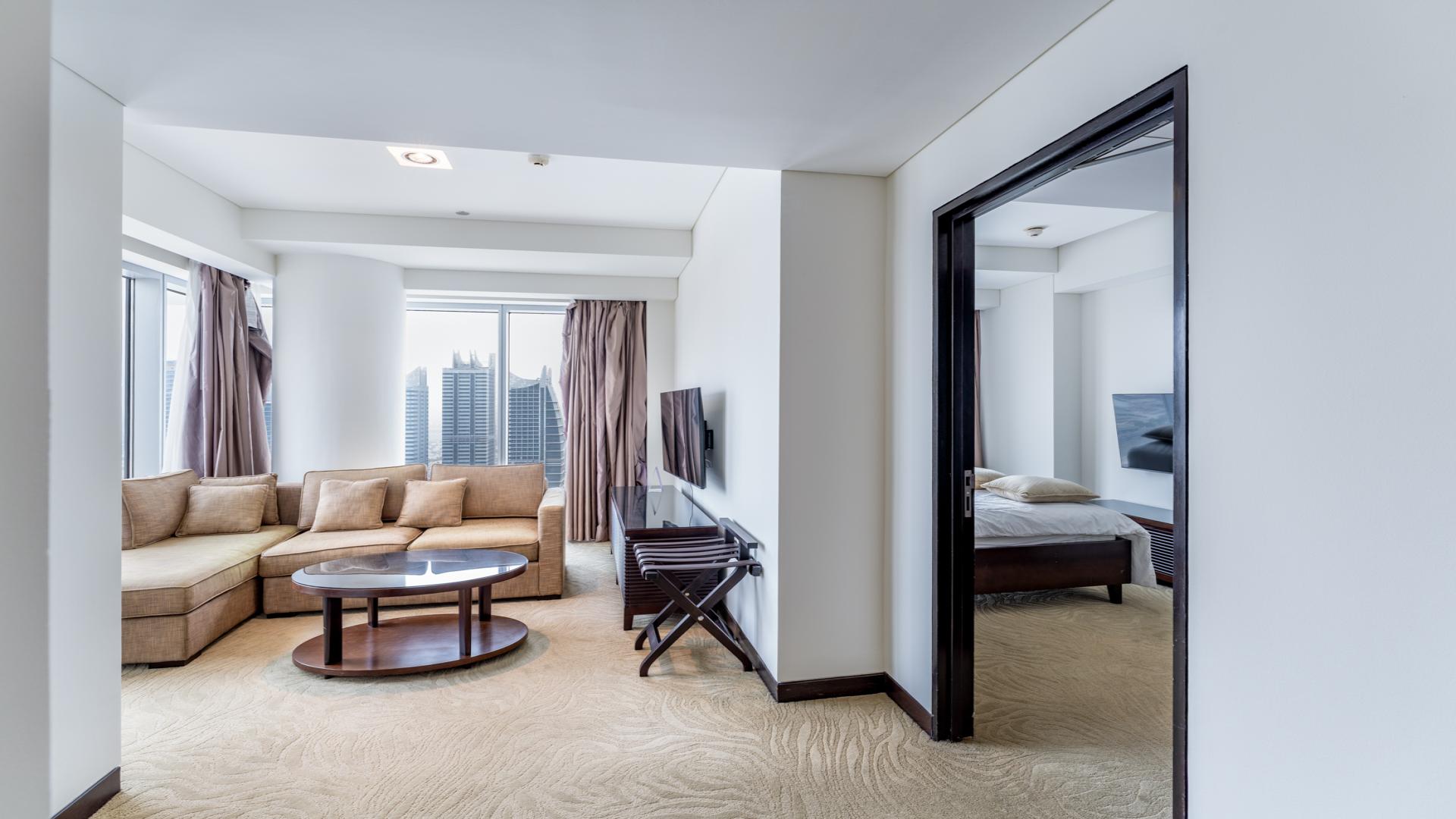 Elegant furnished living room with marina view in Dubai Marina apartment for sale