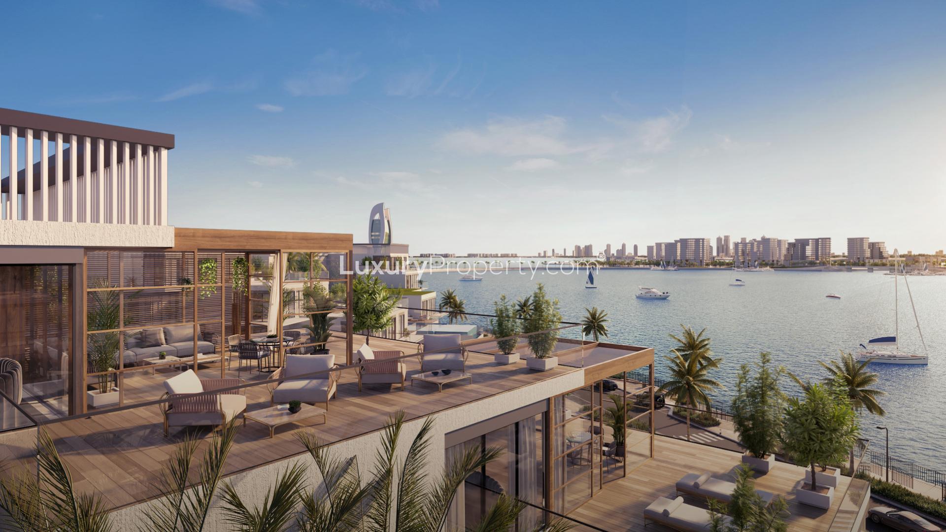 Luxurious waterfront apartment terrace at L’Horizon, Qetaifan Island North, with elegant outdoor seating