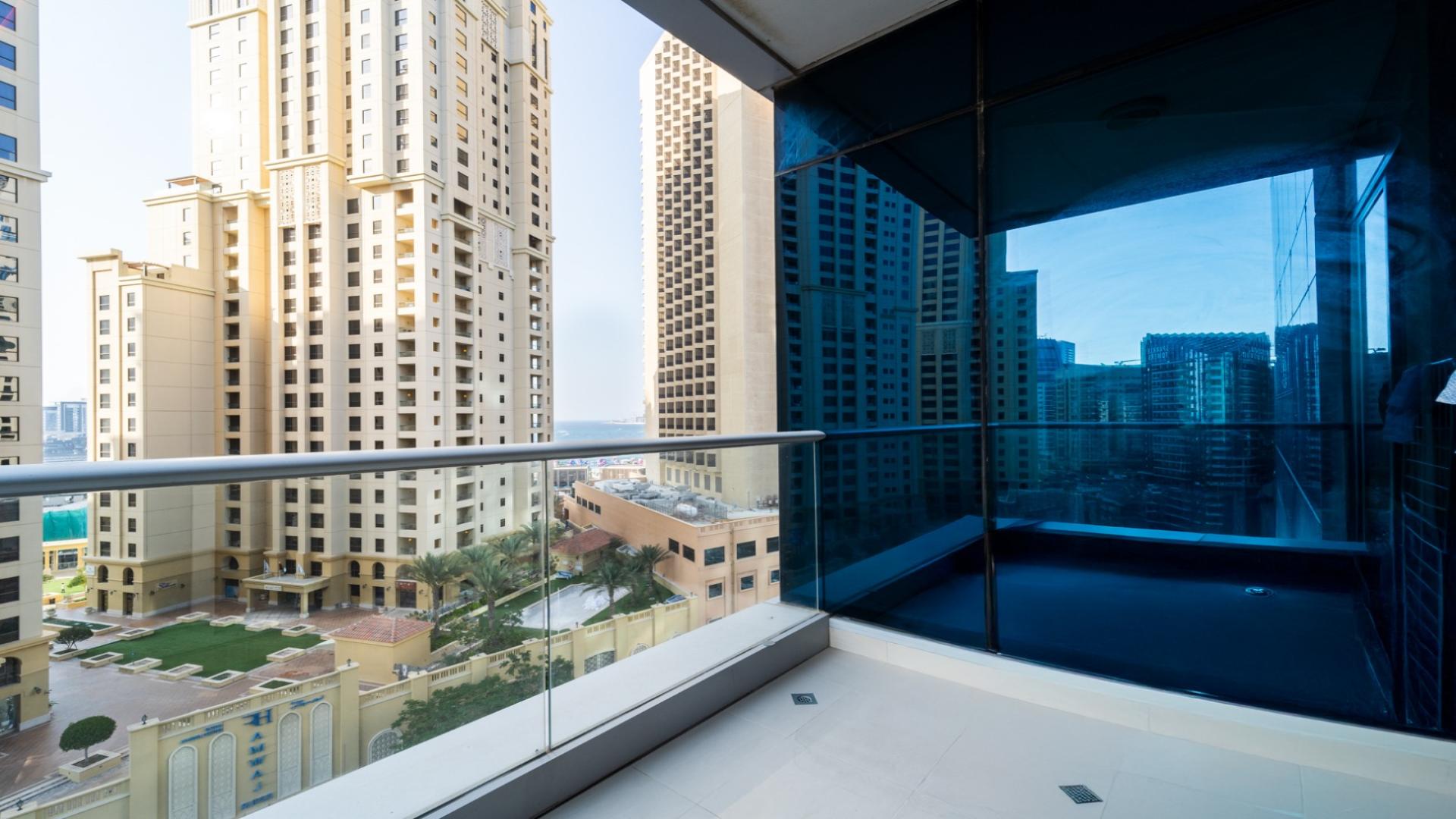 Modern living room in Shemara Tower, Dubai Marina apartment with city view