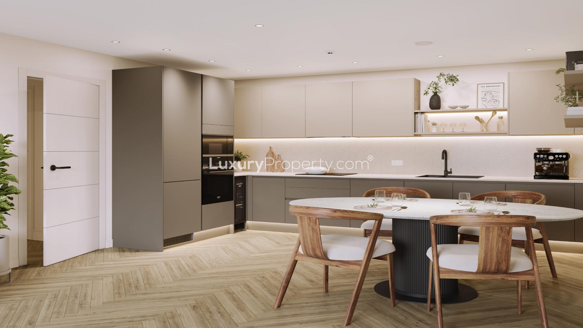 Balcony view from elegant 1-bed apartment in London Square Wandsworth Common, overlooking park