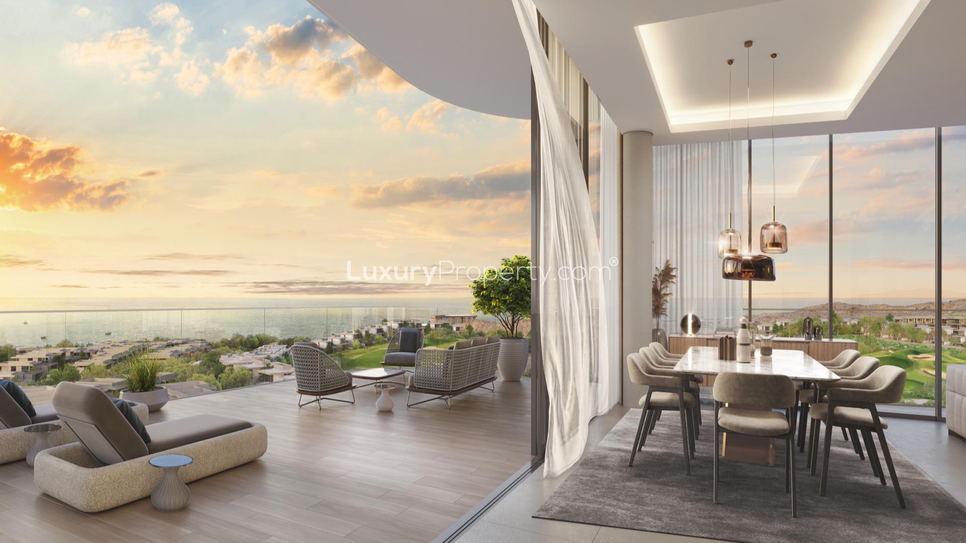 Elegant sea-facing living room in Muscat apartment, featuring modern decor and stunning views