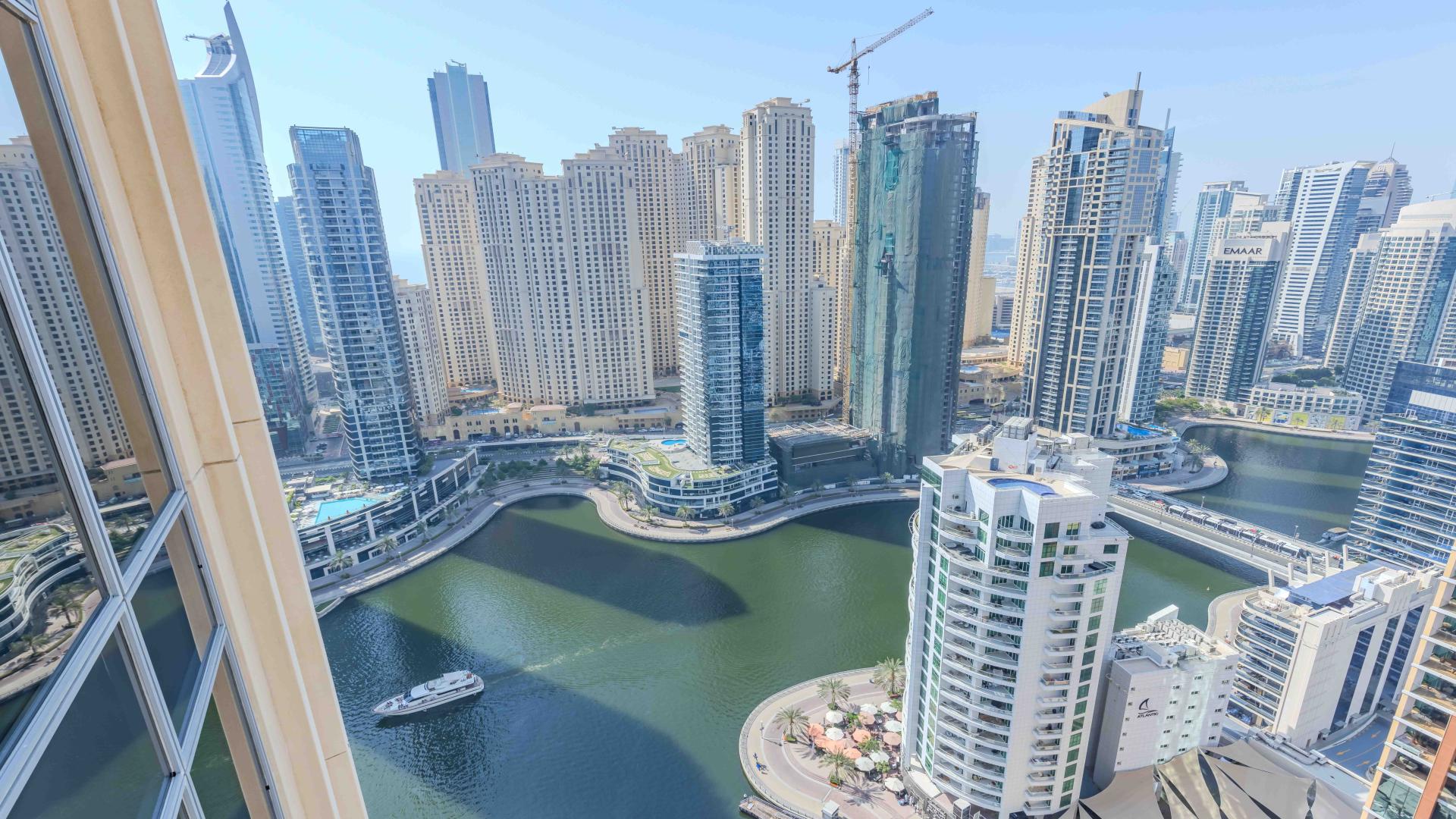 "High-floor apartment living room with marina view in JW Marriott, Dubai Marina, for sale.",High floor apartment with full marina views in JW Marriott, Dubai Marina for sale