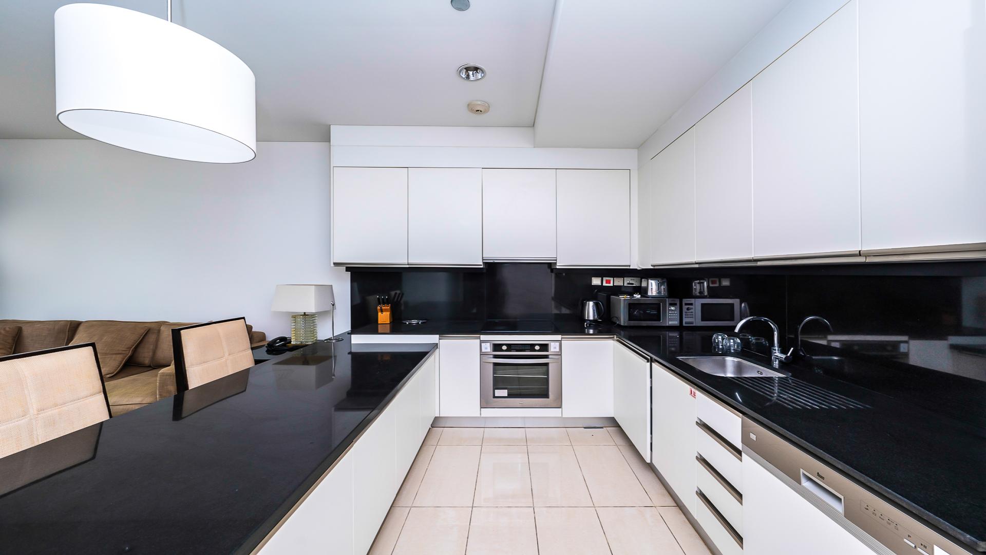 Luxurious Dubai Marina apartment interior with modern kitchen and living area, LP45466