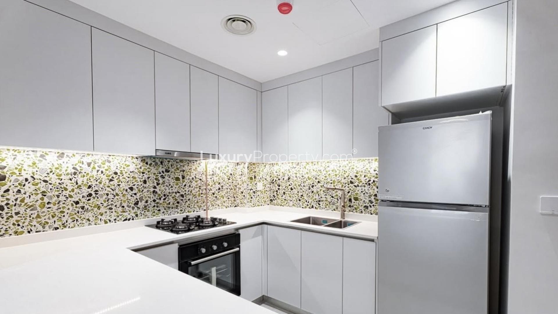 High-floor Neva Residences living room with modern decor, Jumeirah Village Circle apartment