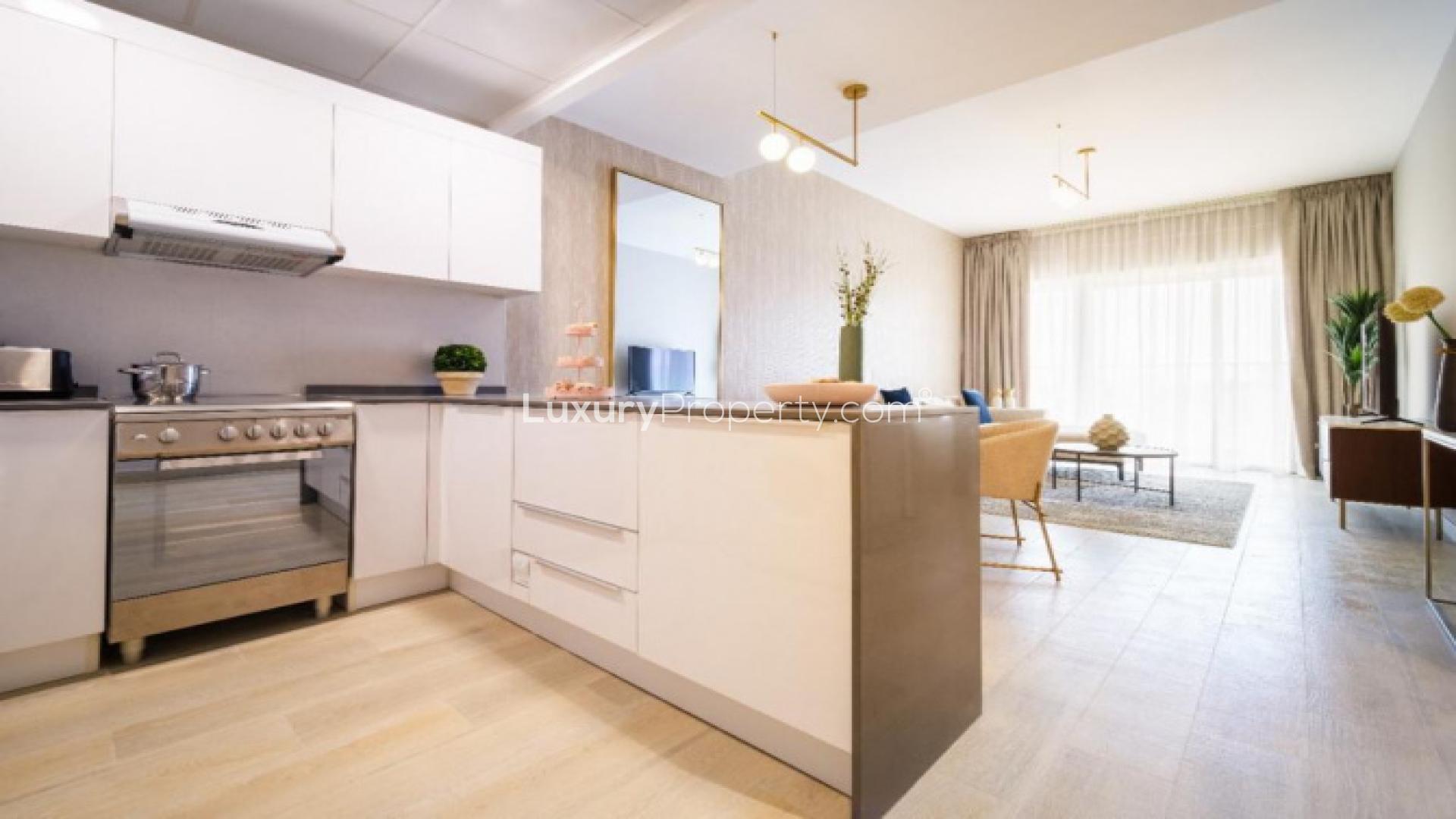 Modern living room and kitchen in Bloom Towers apartment, JVC Dubai, for sale