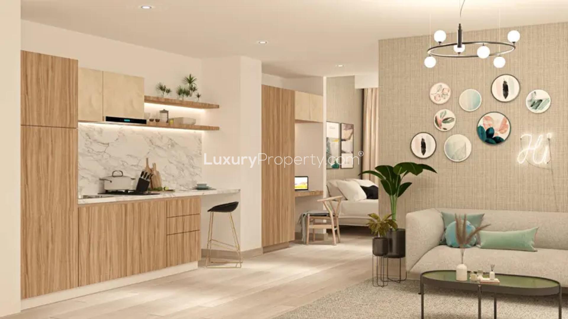 Outdoor pool and basketball court at Aura by Grovy Apartments in JVC, Dubai