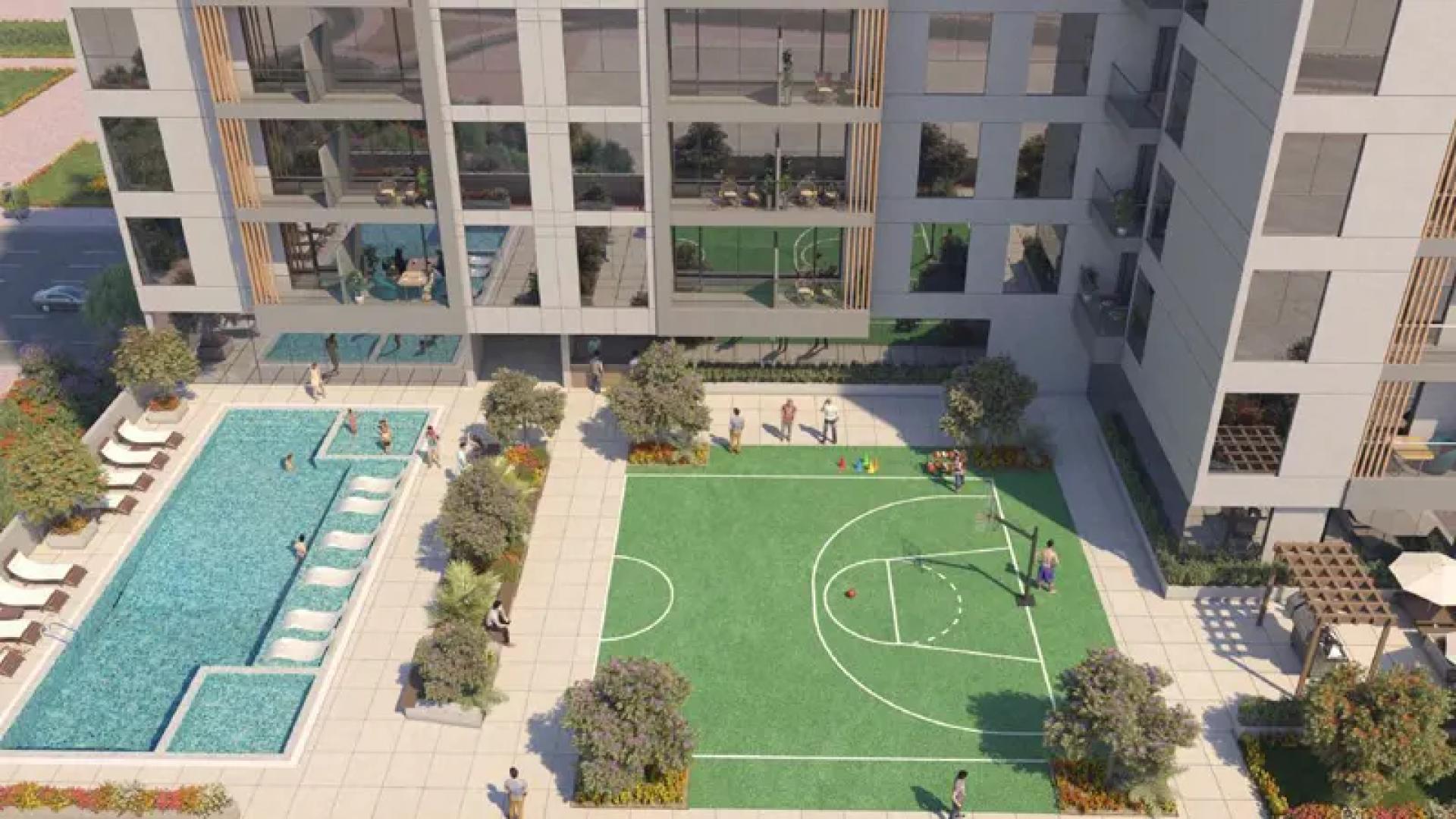 Modern living room in Aura by Grovy apartment, JVC, with skyline views and elegant decor