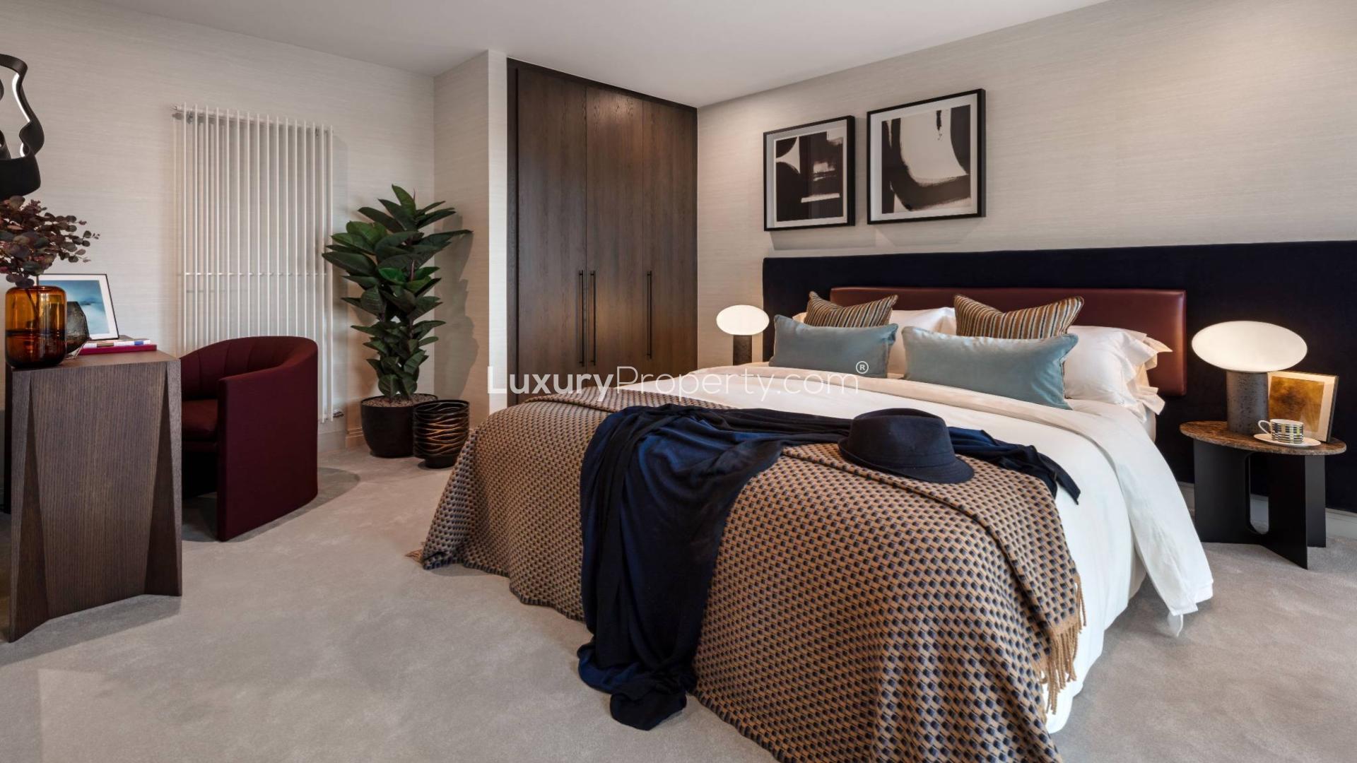 Elegant living room in 11th-floor Queens Cross apartment, featuring modern decor and city views