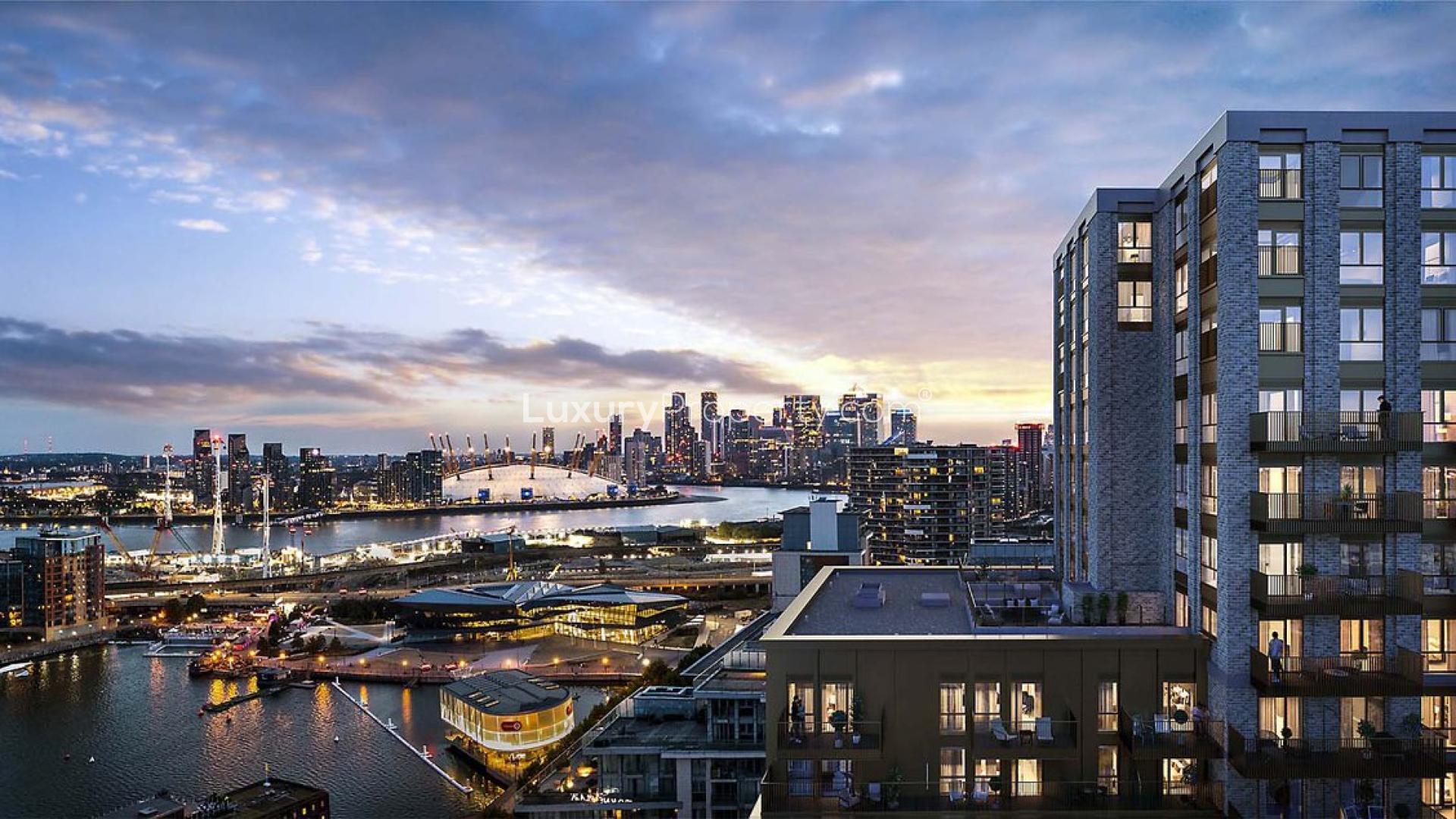 "City view from balcony of stylish apartment near Canary Wharf, Western Gateway, London.",Skyline view from stylish apartment near Canary Wharf, Western Gateway, London at sunset