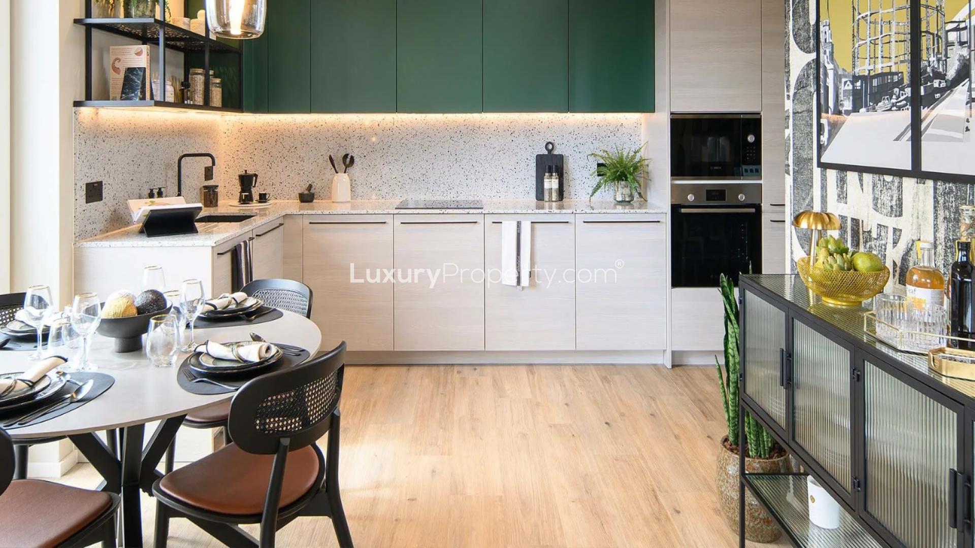 Modern kitchen interior in one-bedroom Heron Wharf apartment, London with stylish dining area