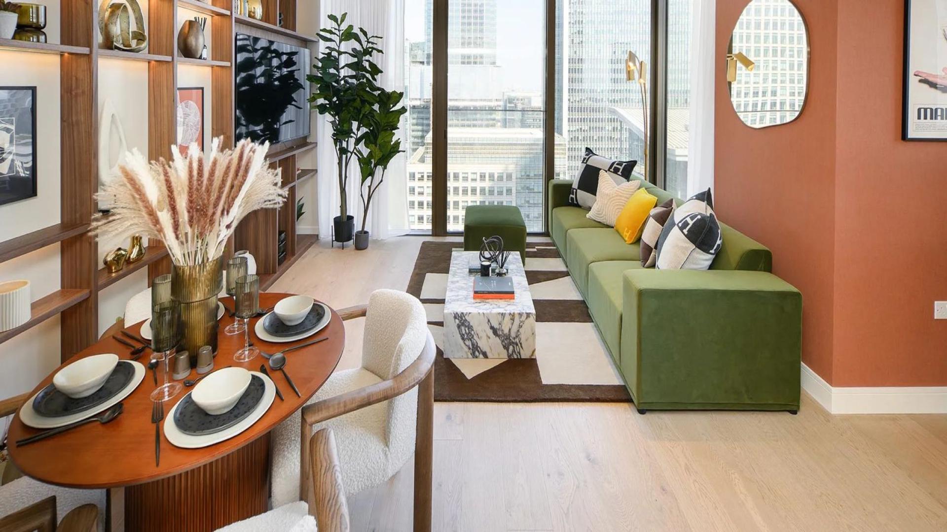 Modern living room in Harcourt Gardens apartment, featuring elegant decor and city skyline views