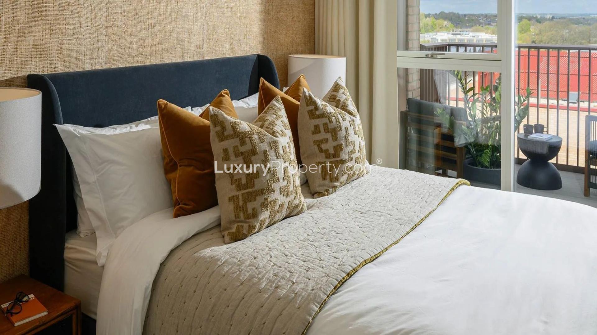 Modern bedroom with balcony view in Alexandra Gate apartment, London