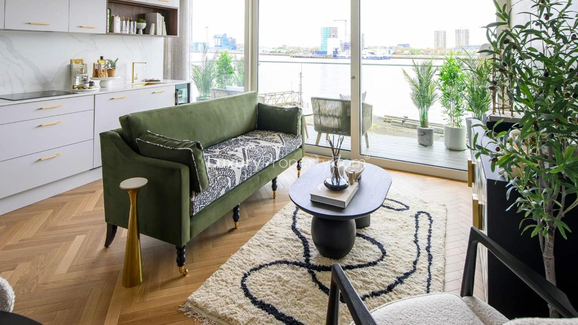 Elegant bedroom in one-bed apartment, Royal Arsenal Riverside, London, with stylish decor and artwork