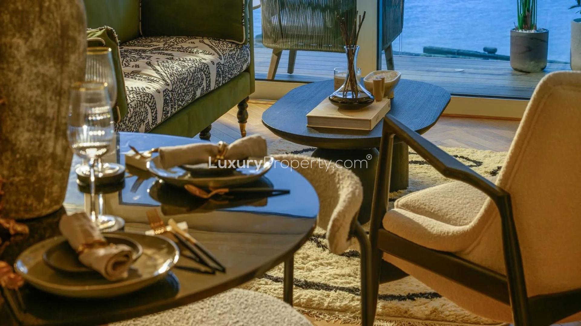 Modern kitchen with gold accents in Royal Arsenal Riverside apartment, London