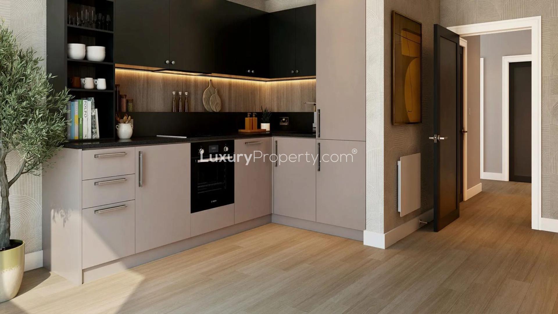 Modern apartment buildings at The Pavilions, Eden Grove, London, surrounded by greenery