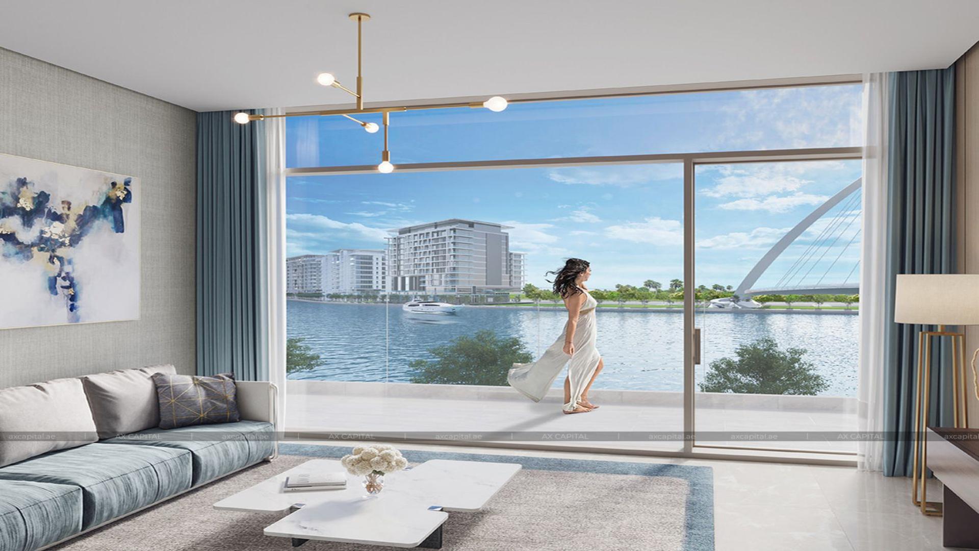 Modern kitchen and living room in Sobha Hartland apartment with city skyline view