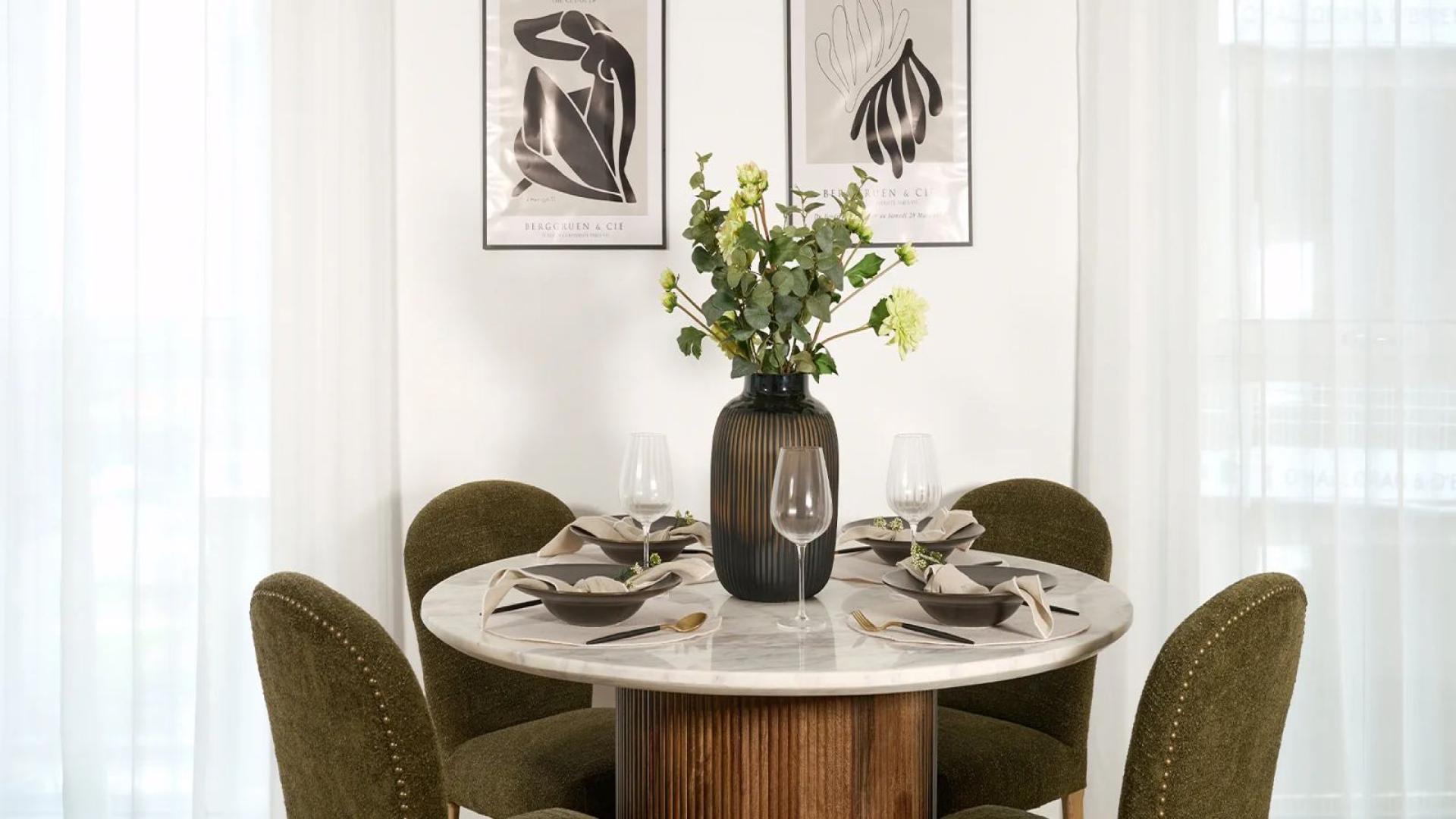 Cozy living area with red sofa and side table in Ealing apartment for sale