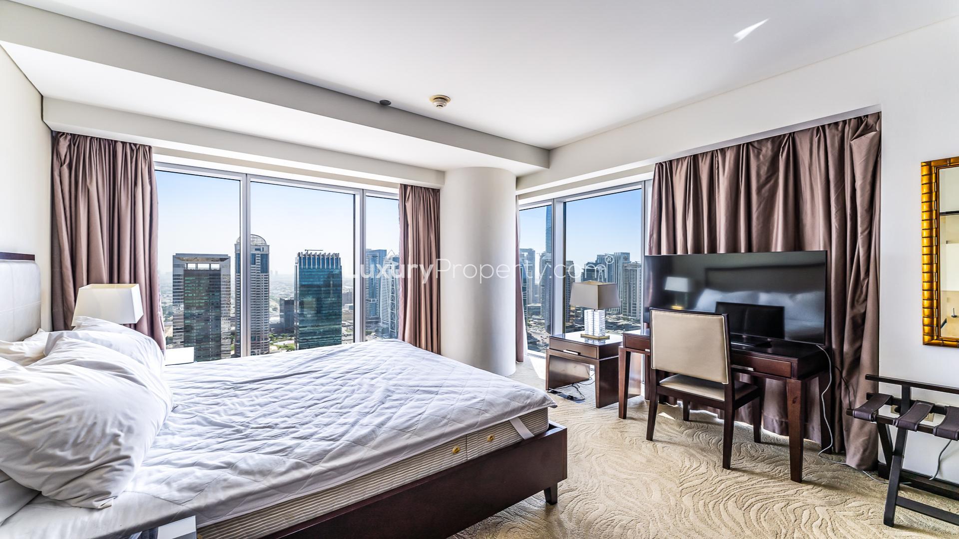 "Stunning Marina view from JW Marriott Hotel apartment in Dubai Marina, for sale.",Elegant living room in JW Marriott Marina apartment, featuring modern decor and spacious layout
