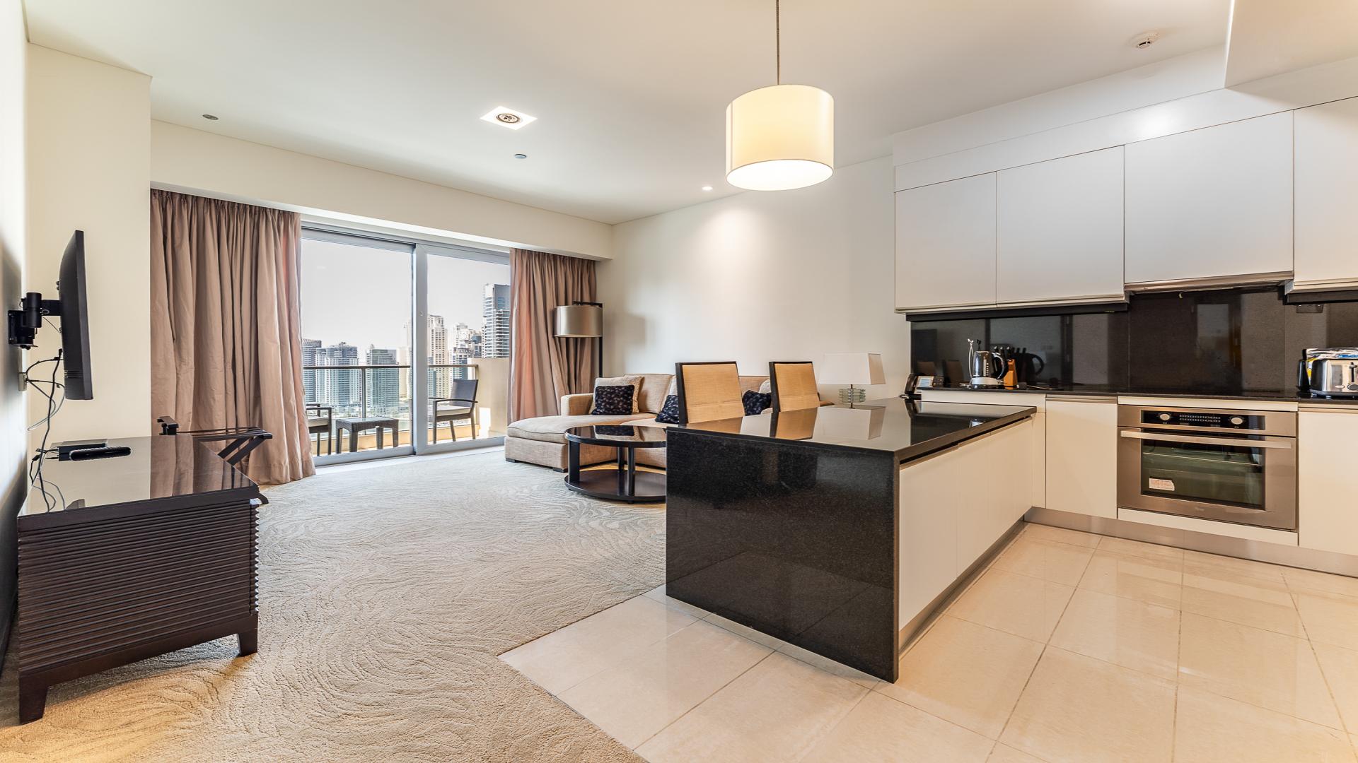 Dubai Marina apartment balcony view with skyscrapers and waterfront, JW Marriott Hotel Marina nearby