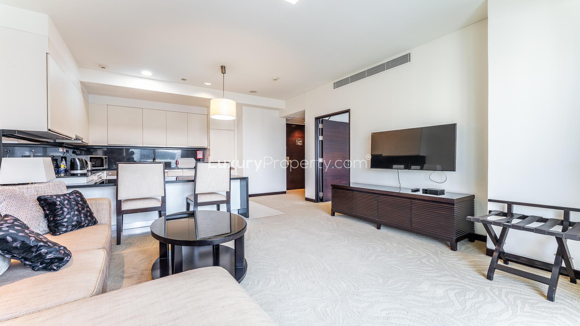 Modern one-bedroom apartment interior with balcony view in JW Marriott Hotel Marina, Dubai