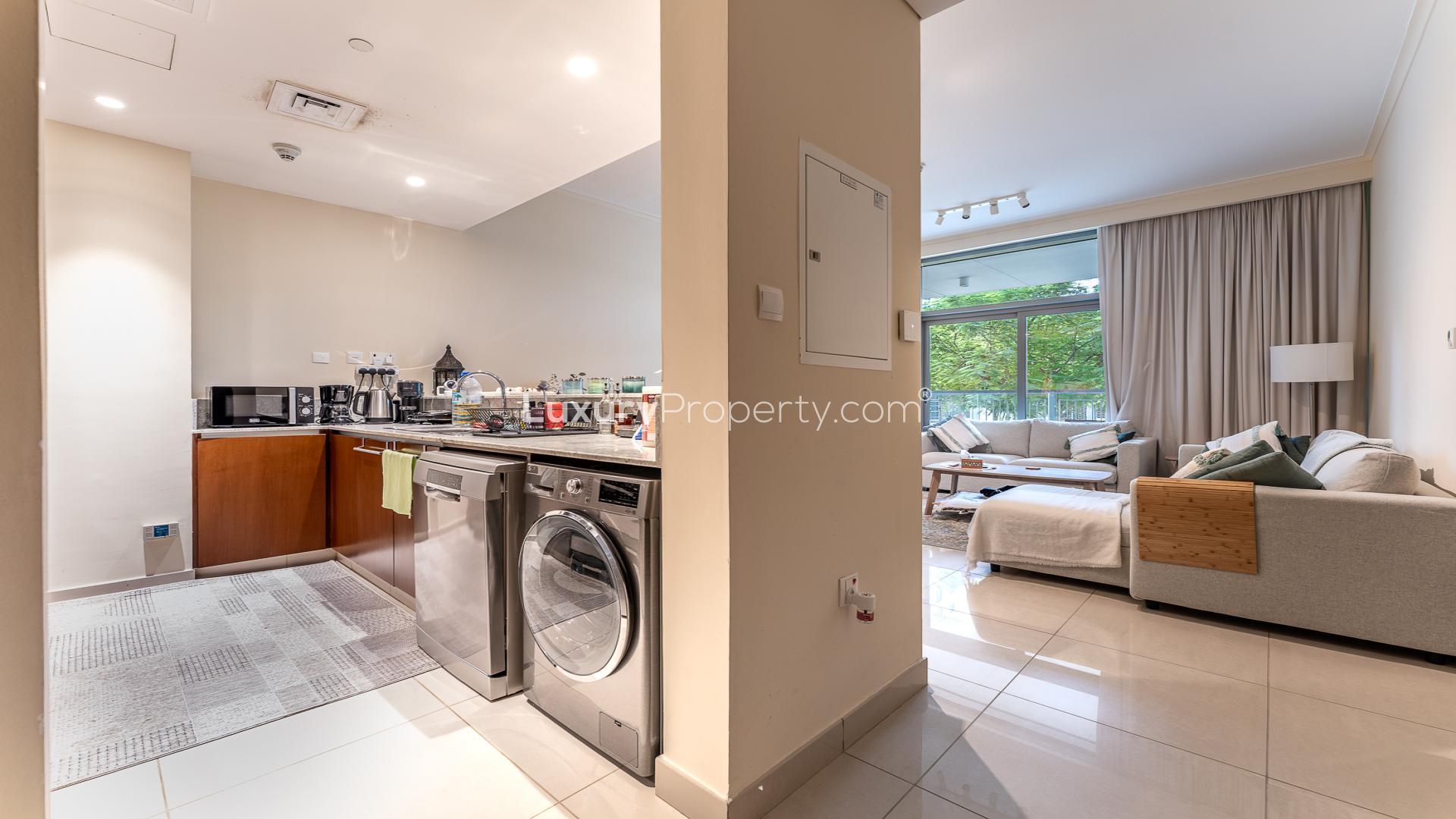Cozy living room with large windows in Mulberry apartment, Dubai Hills Estate