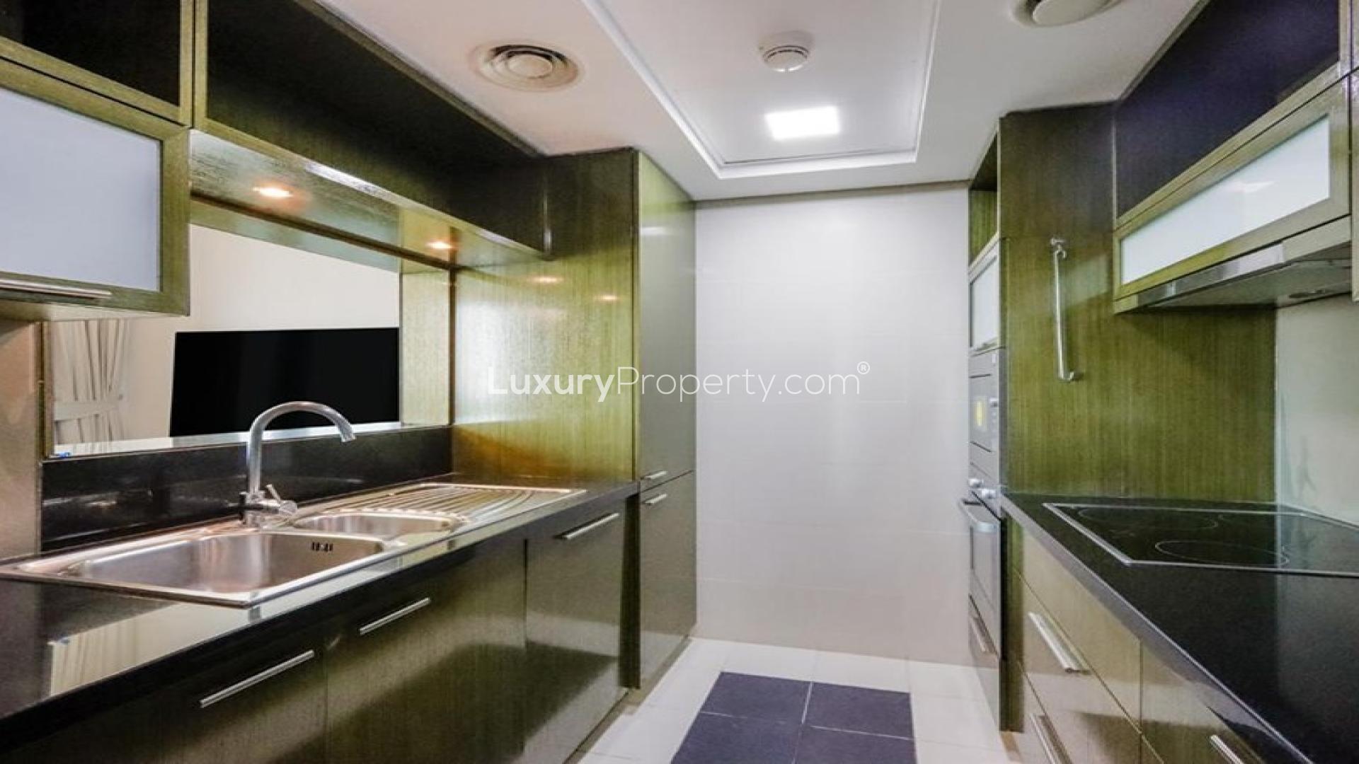 Modern dining area in The Lofts Central apartment, Downtown Dubai, with city view